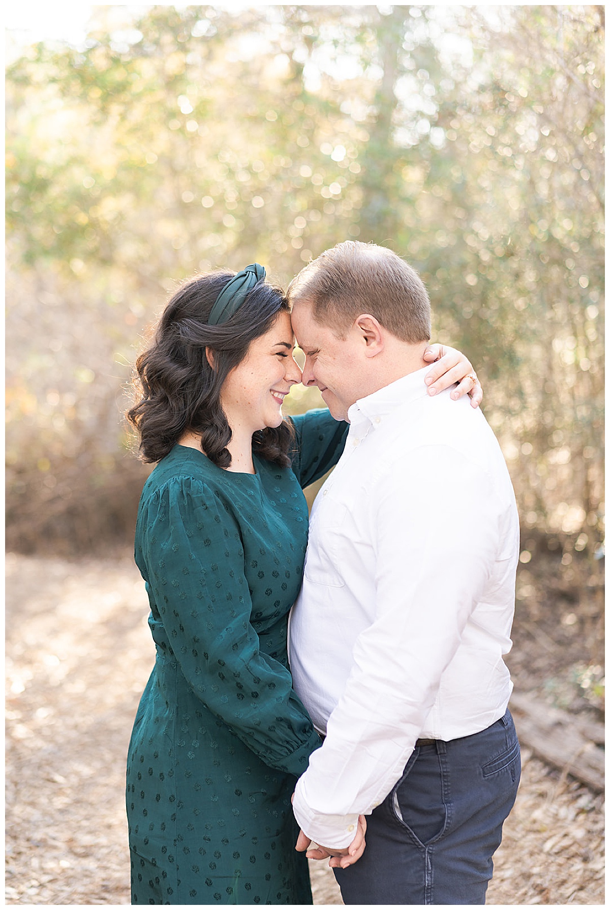 Man and woman smile together after Ninfa’s Engagement Session