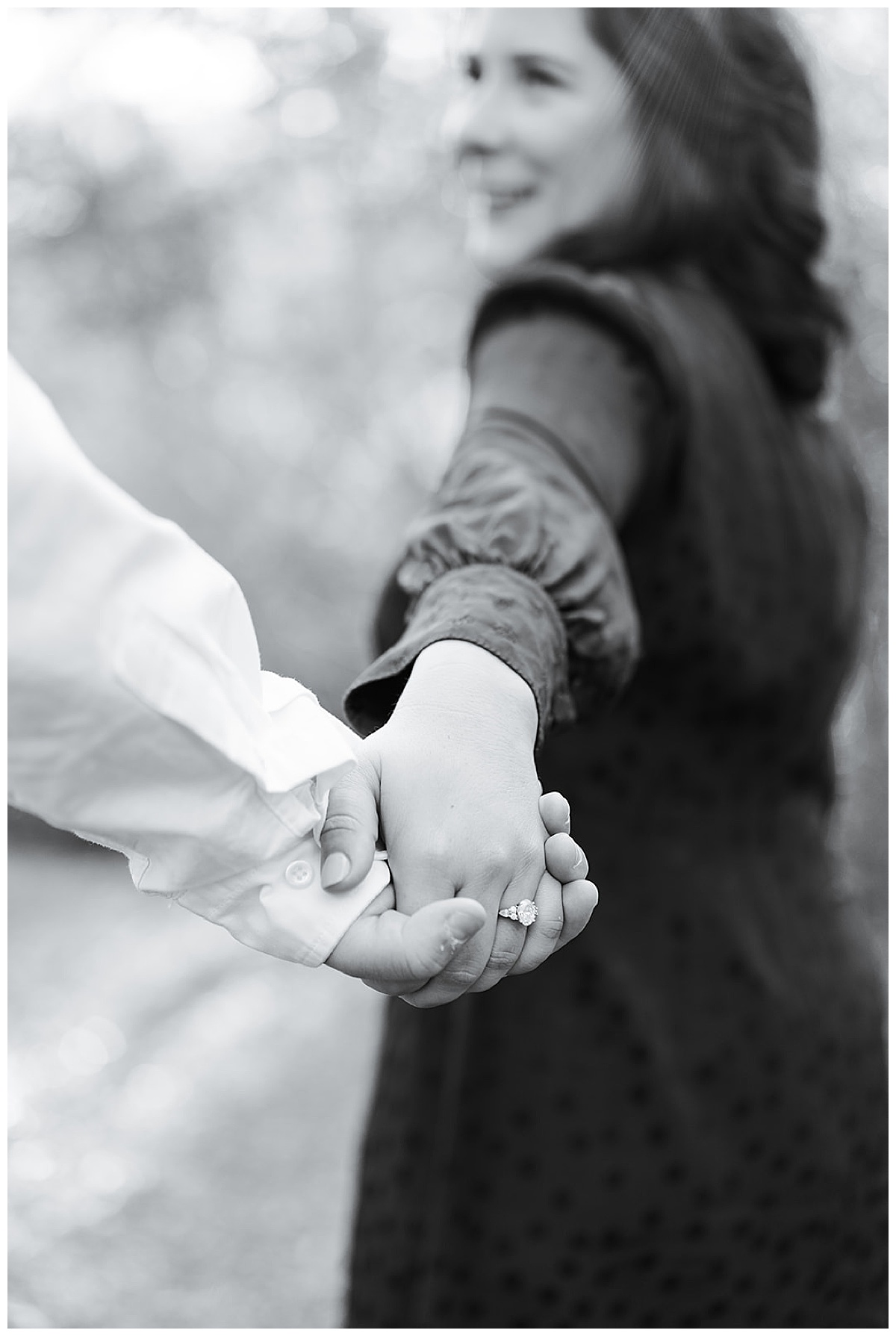 Man and woman holds hands for Swish & Click Photography