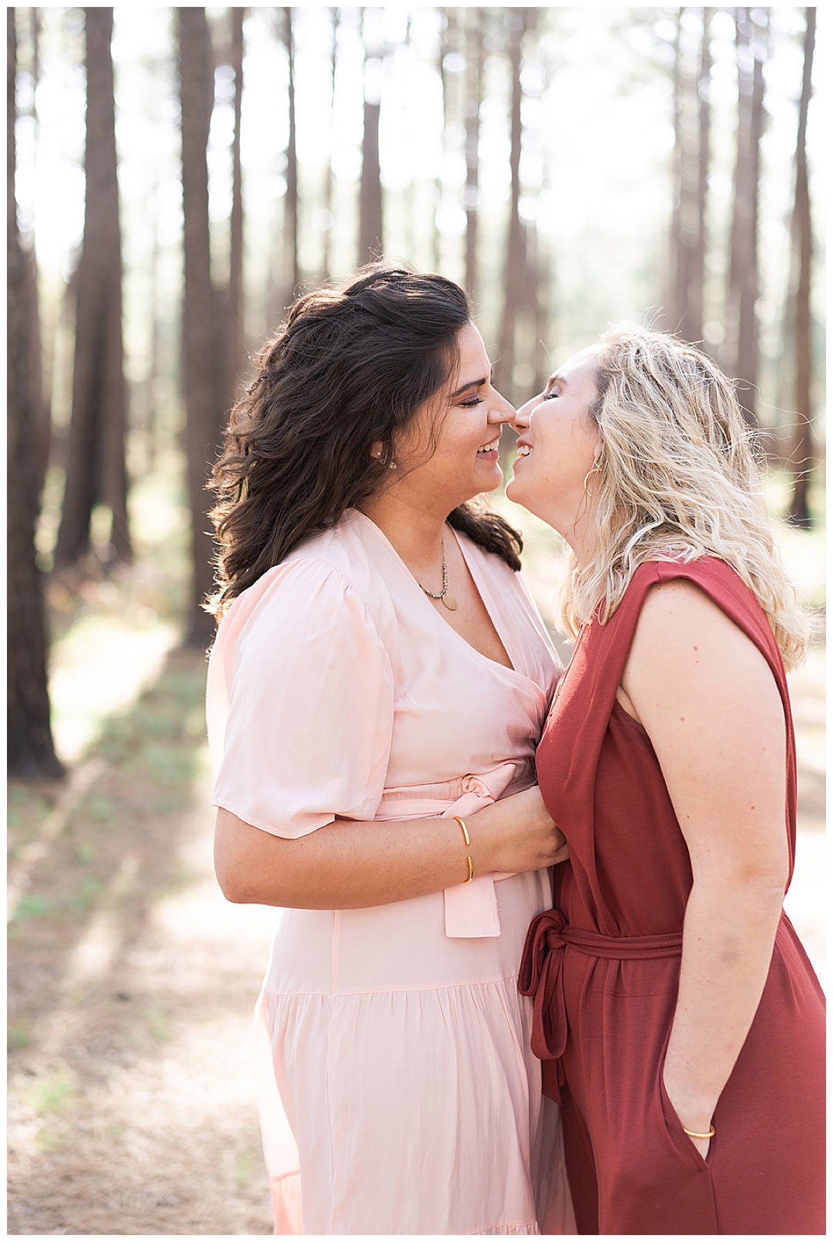 Two women kiss one another for Houston’s Best Wedding Photographers