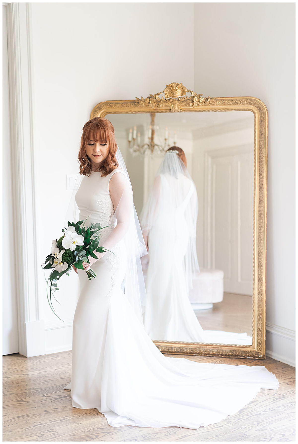 Gorgeous bride stands in front of mirror for Houston’s Best Wedding Photographers