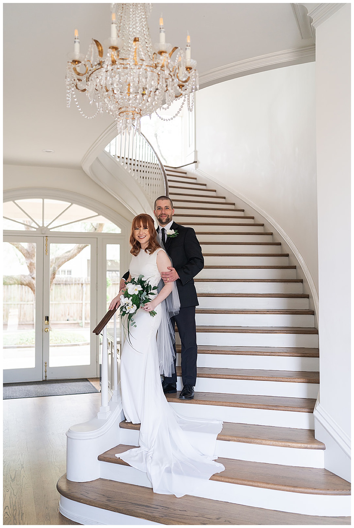 Groom and bride stand on staircase for Swish & Click Photography