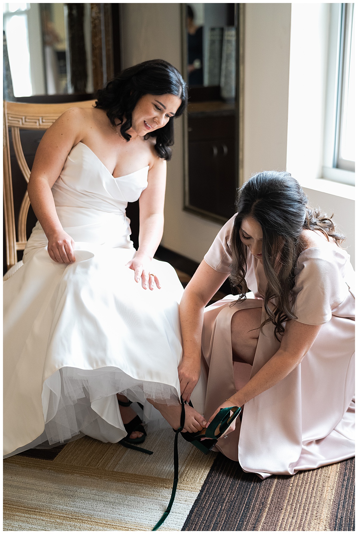Bride gets helped into wedding shoes for Houston’s Best Wedding Photographers