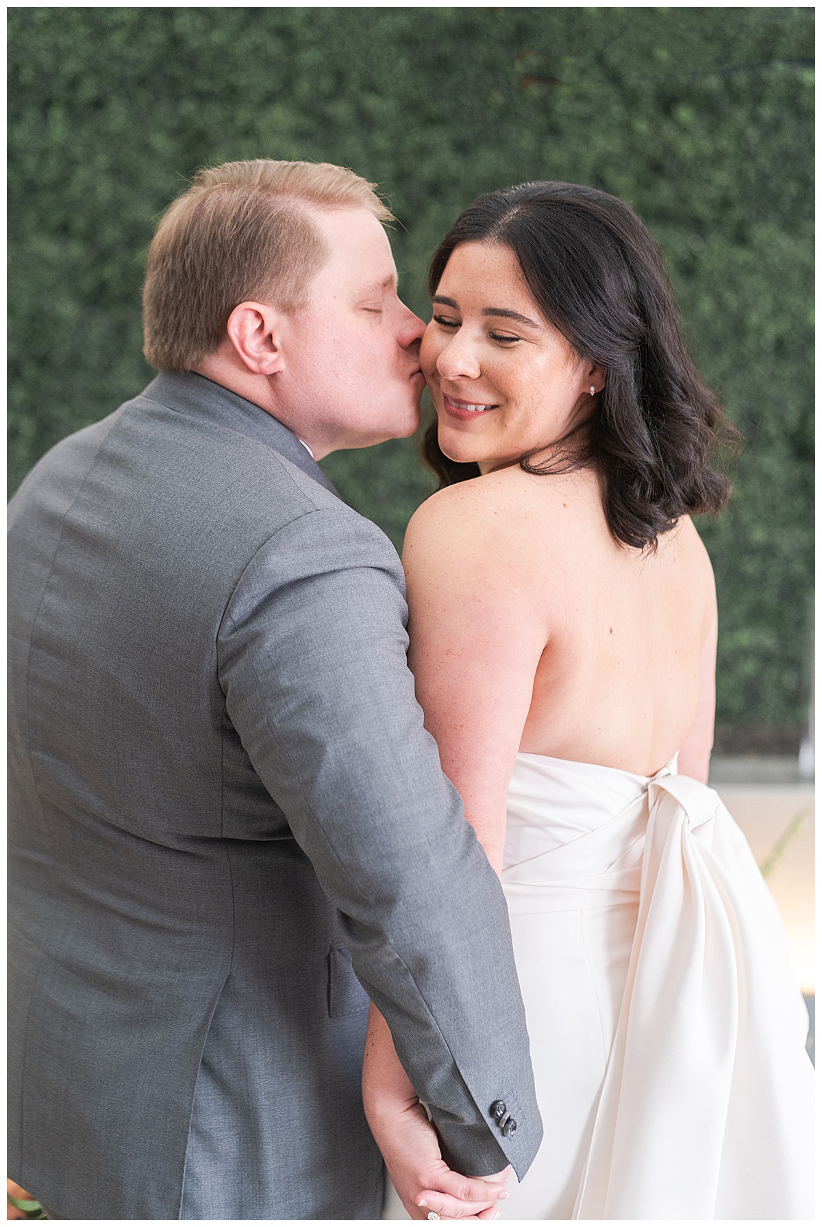 Guy kisses girl on cheek for Swish & Click Photography