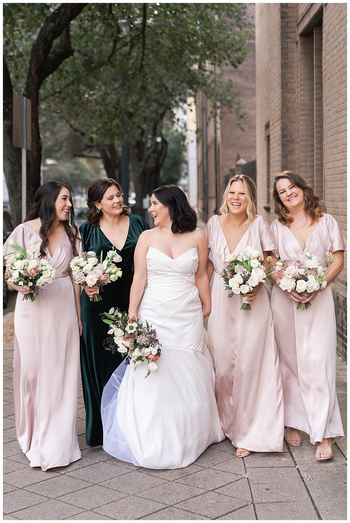 Bride smiles and laughs with family and friends at The Sam Houston Hotel