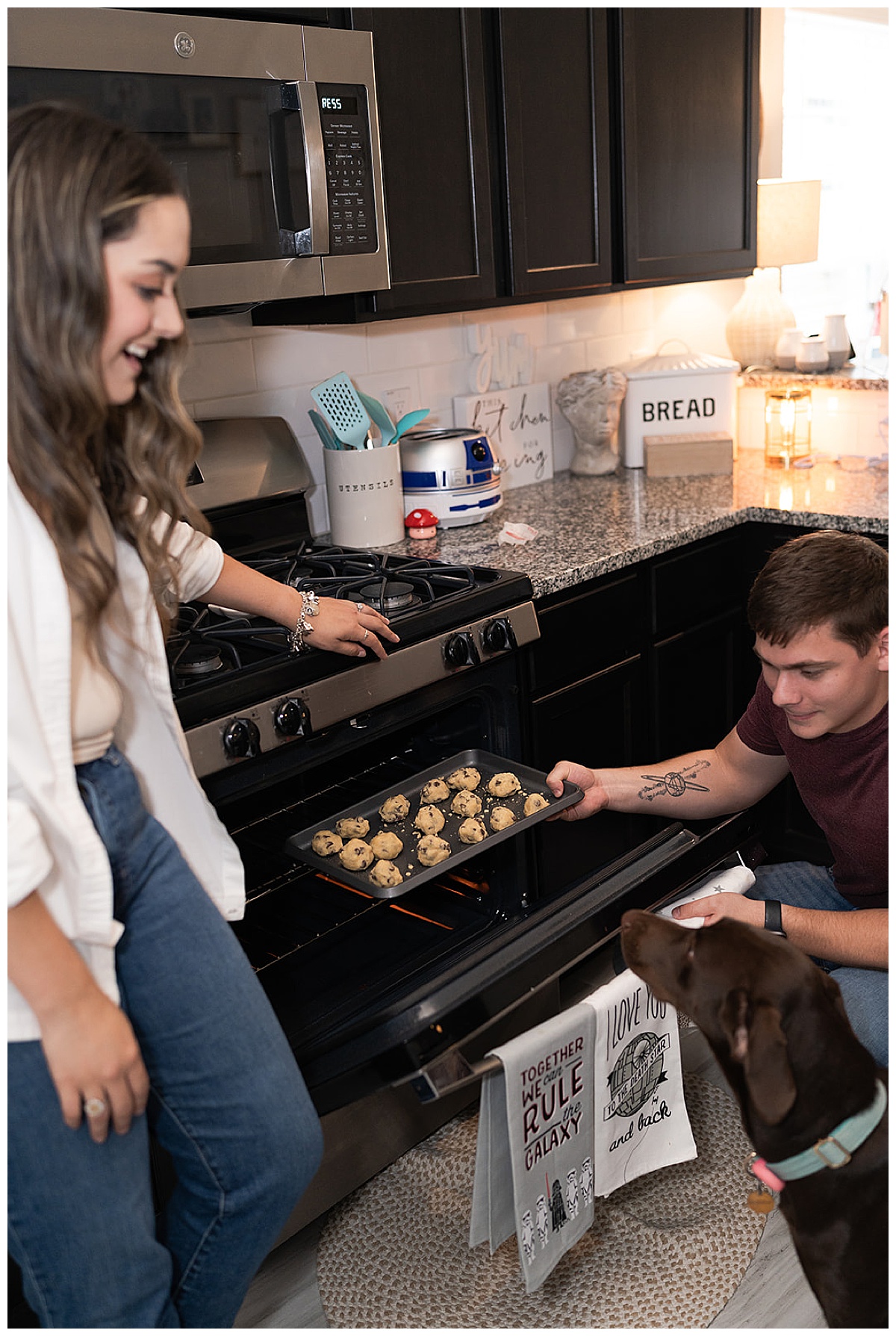 Couple takes cookie out of oven Swish & Click Photography