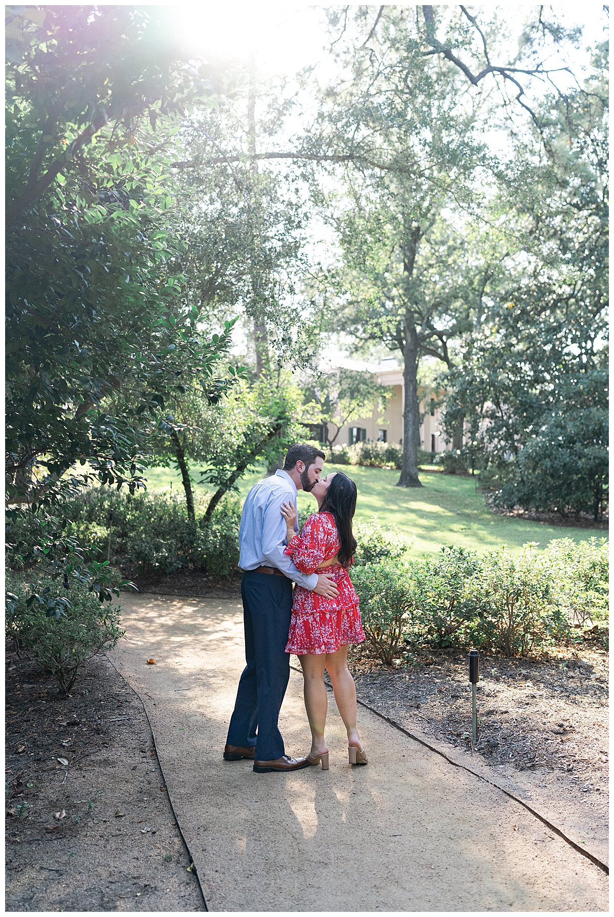 Two people share a hug and kiss after Bayou Bend Collection and Gardens Proposal
