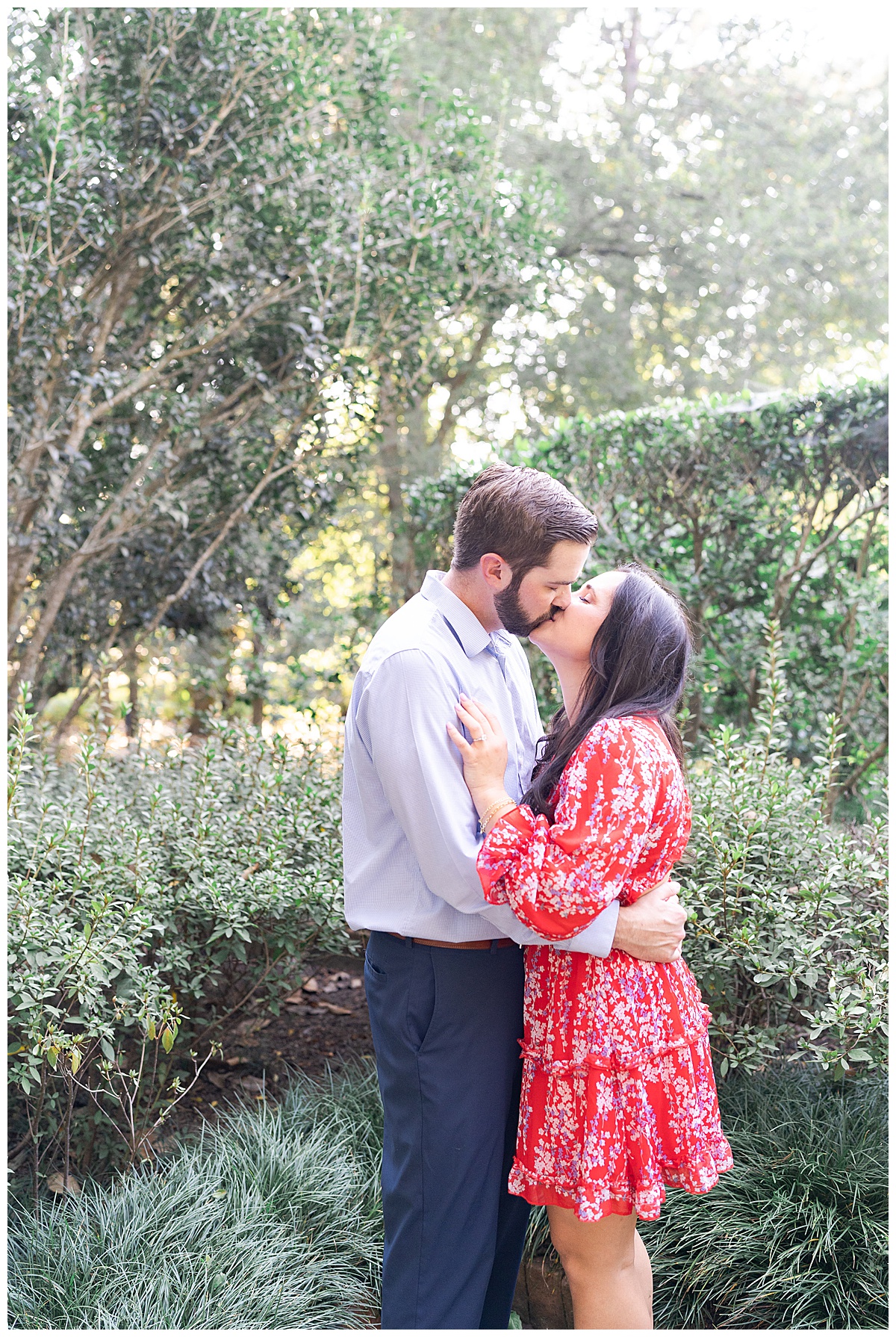 Two adults share a hug and kiss after Bayou Bend Collection and Gardens Proposal
