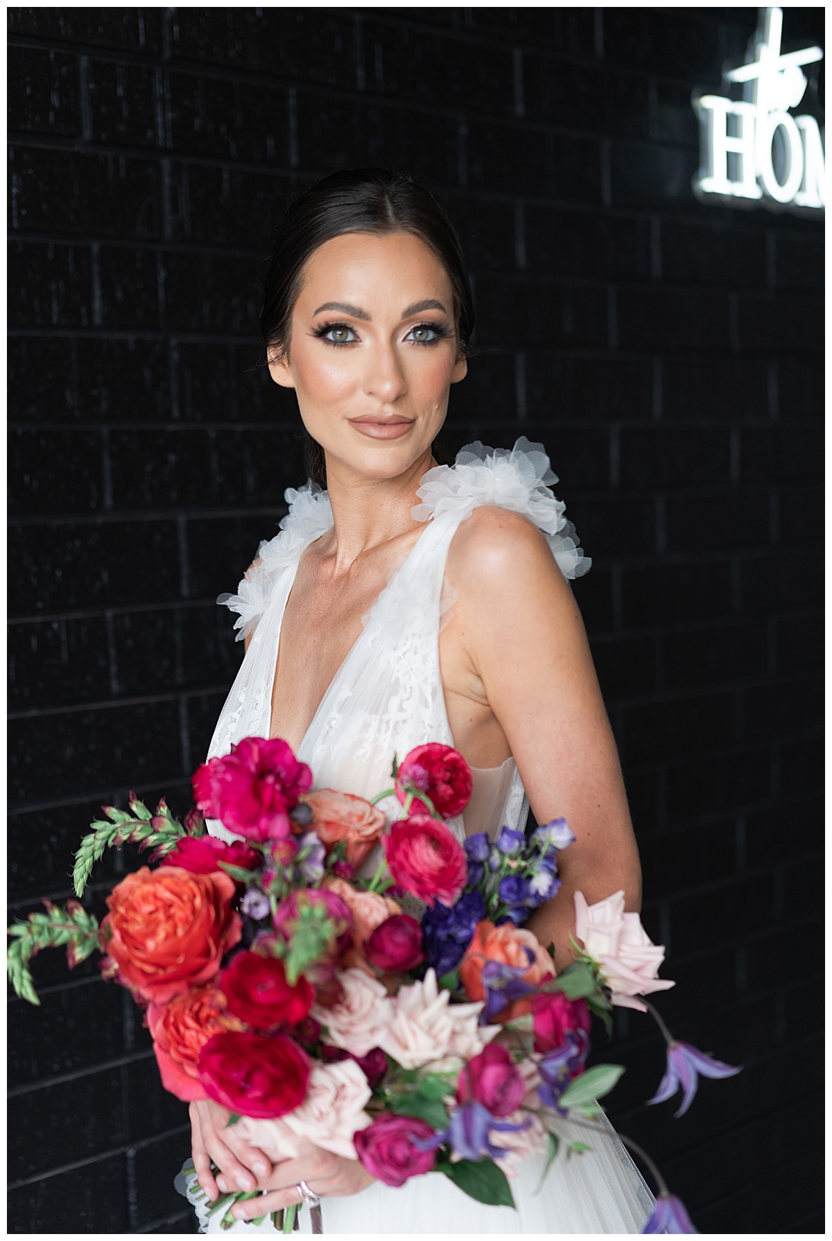 Gorgeous bride holding bold and funky bouquet for Swish & Click Photography 
