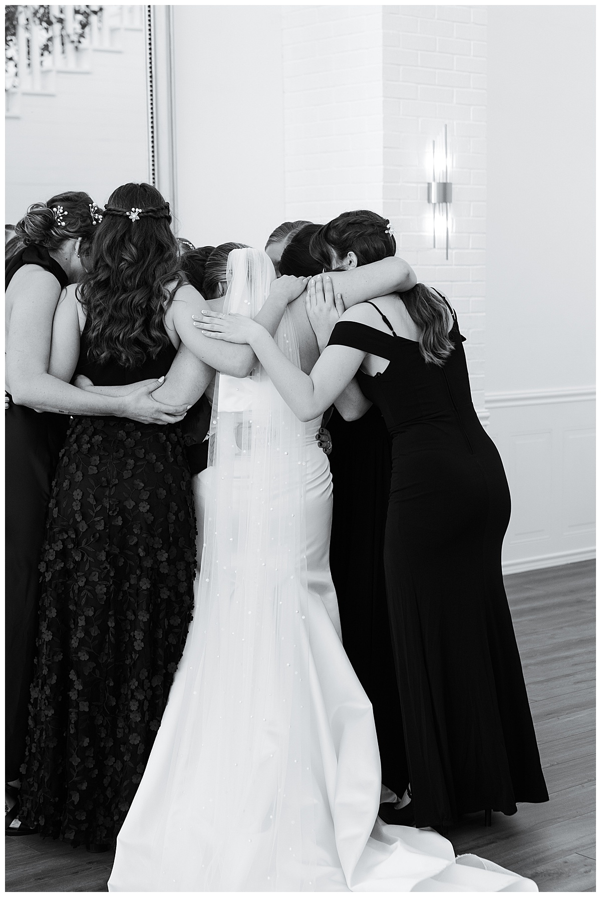 Family and friends hug the bride at Charleston Lane 