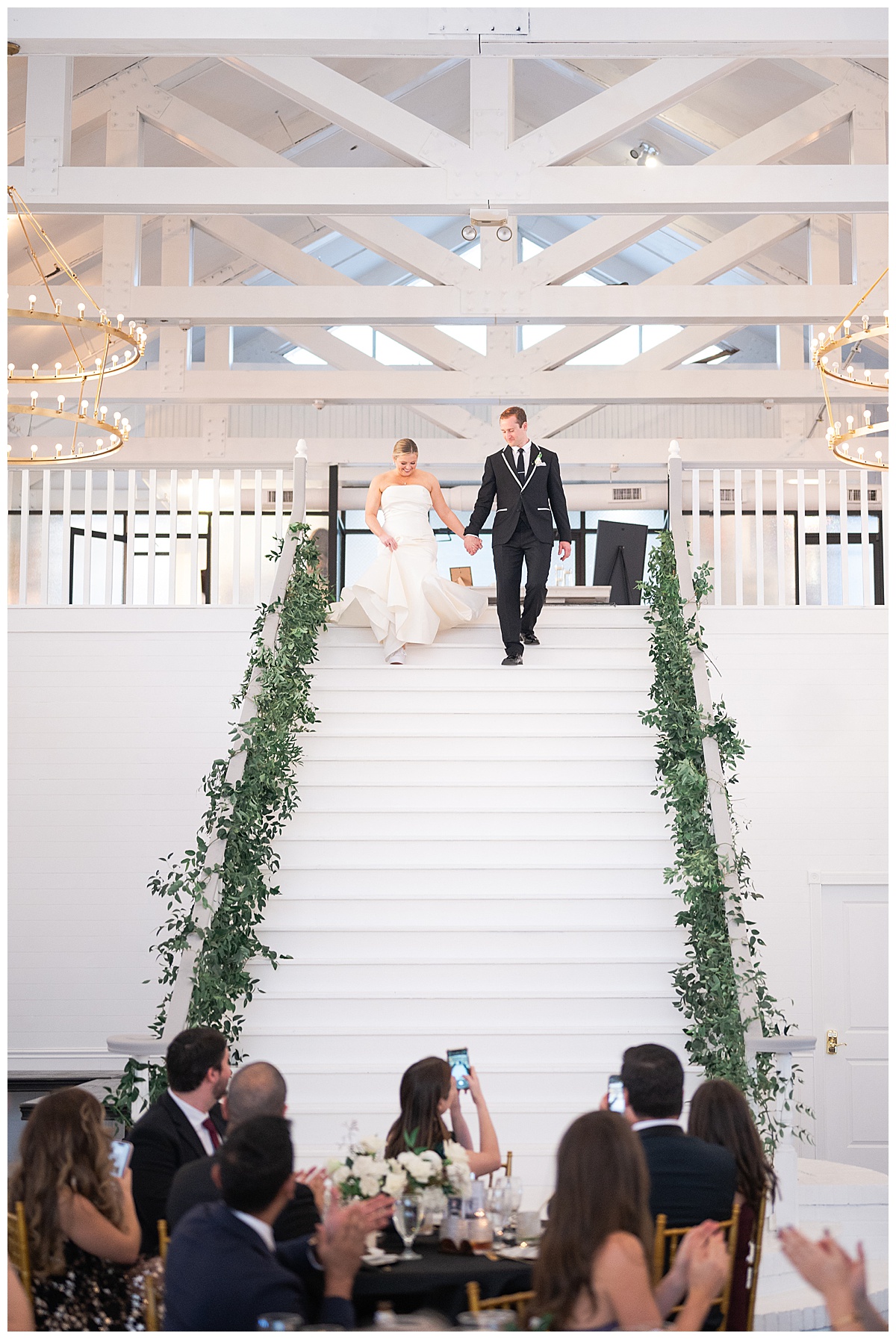 Husband and wife walk down the stairs for Houston’s Best Wedding Photographers