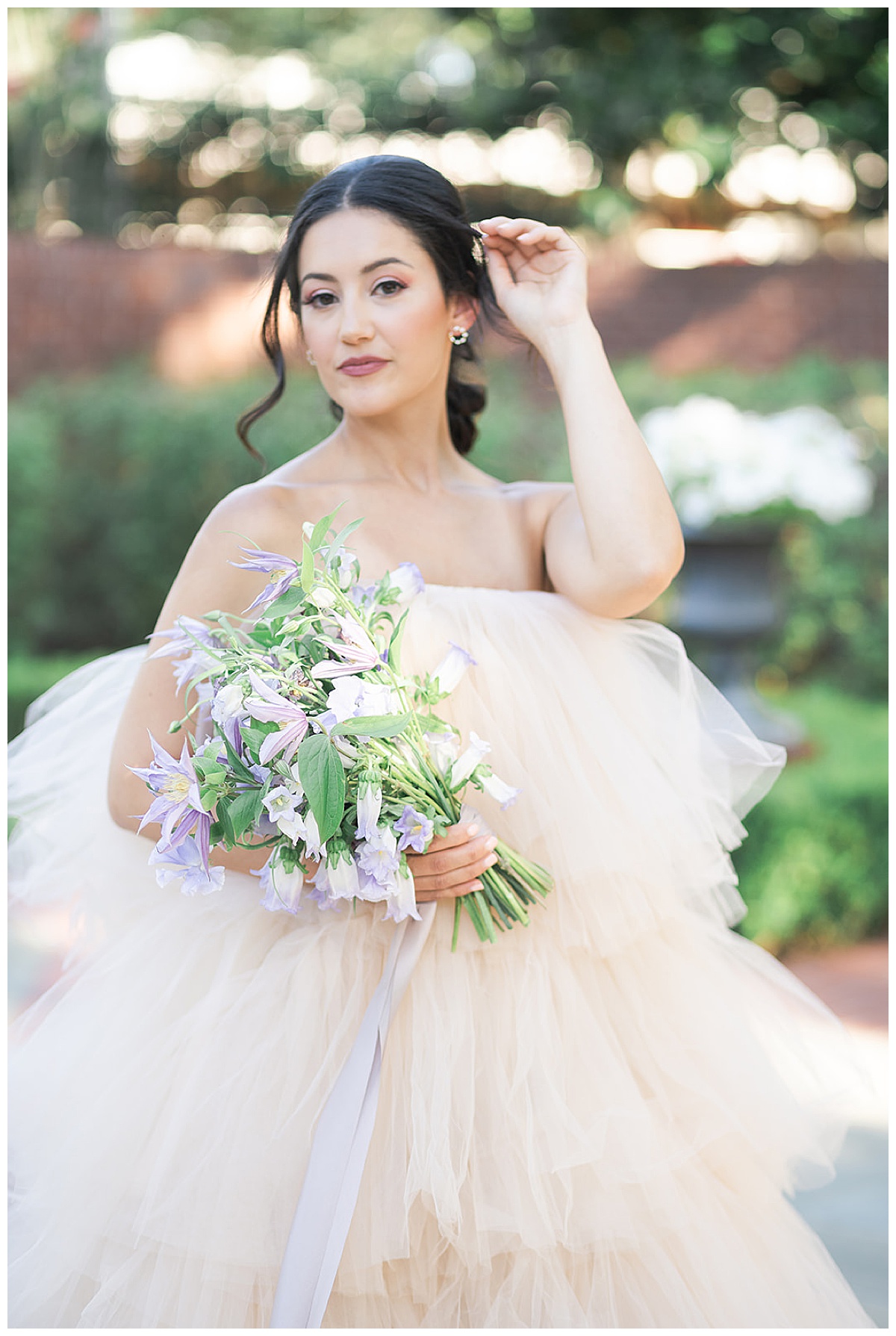 Bride holds bouquet of flowers for Swish & Click Photography