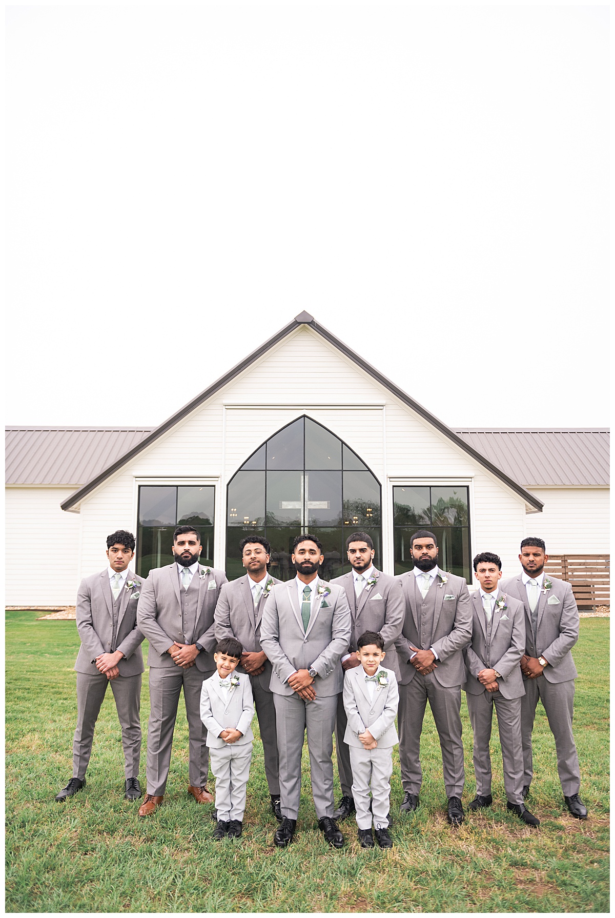 Groomsmen stand together at Deep in the Heart Farms