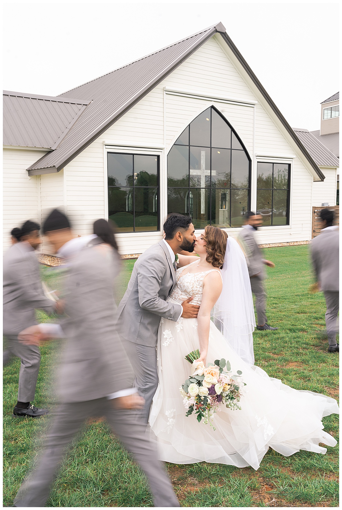 Husband and wife share a kiss for Swish & Click Photography