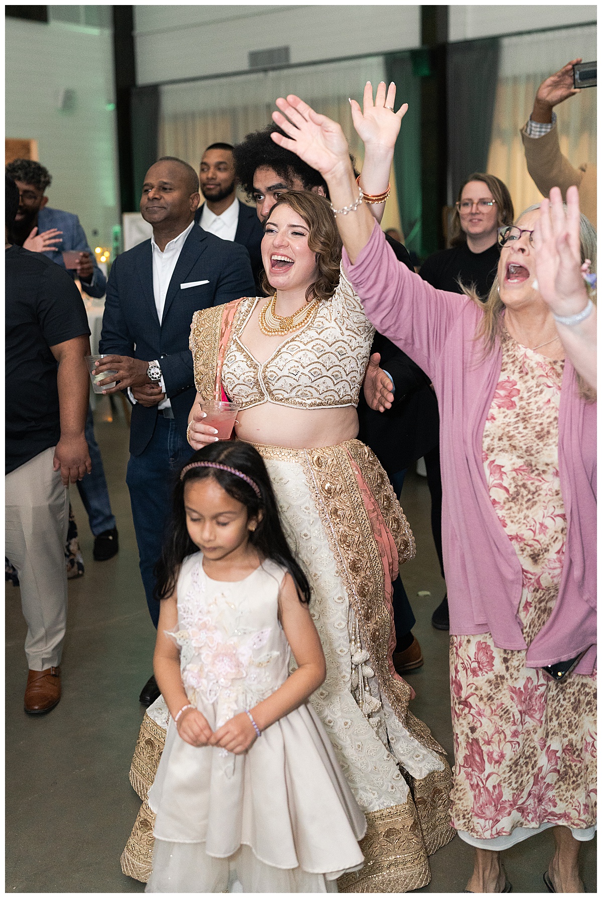  Bride dances with family and friends for Houston’s Best Wedding Photographers 