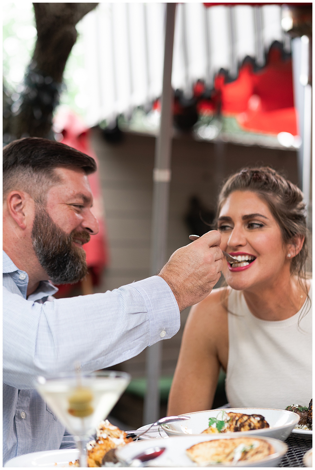 Couple share dinner together for Downtown Houston Engagement Session