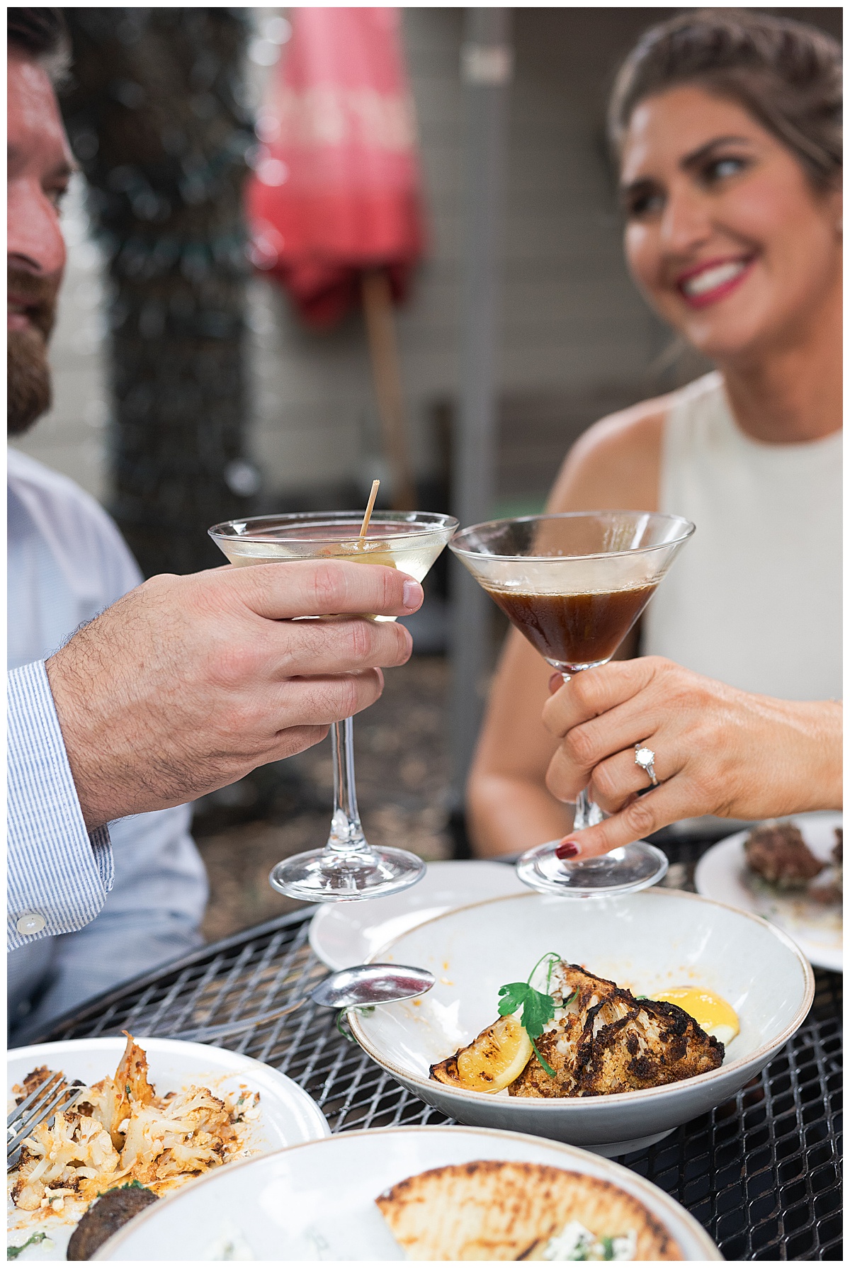 Two people cheers with their drinks for Houston’s Best Wedding Photographers