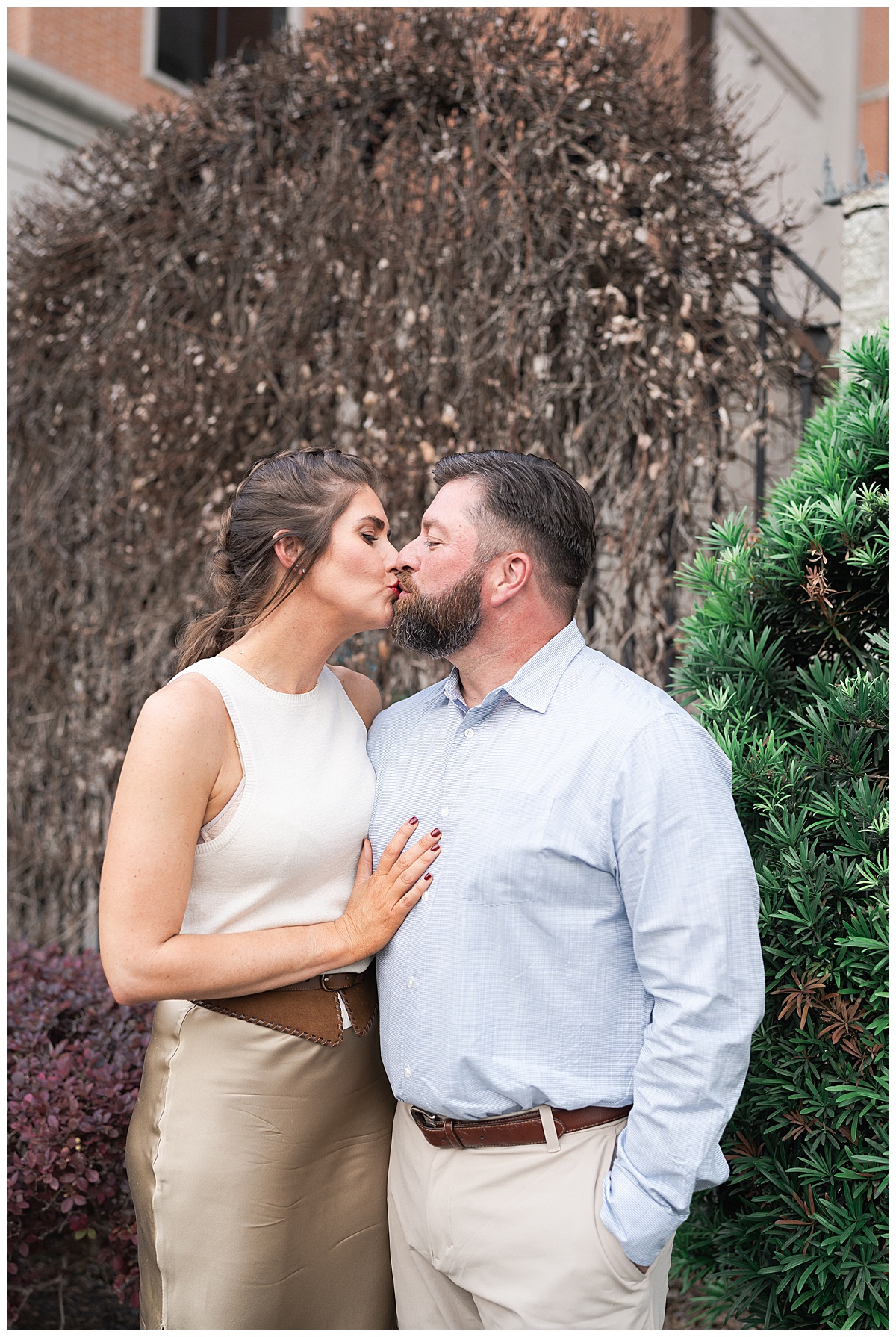 Future husband and wife share a kiss for Downtown Houston Engagement Session