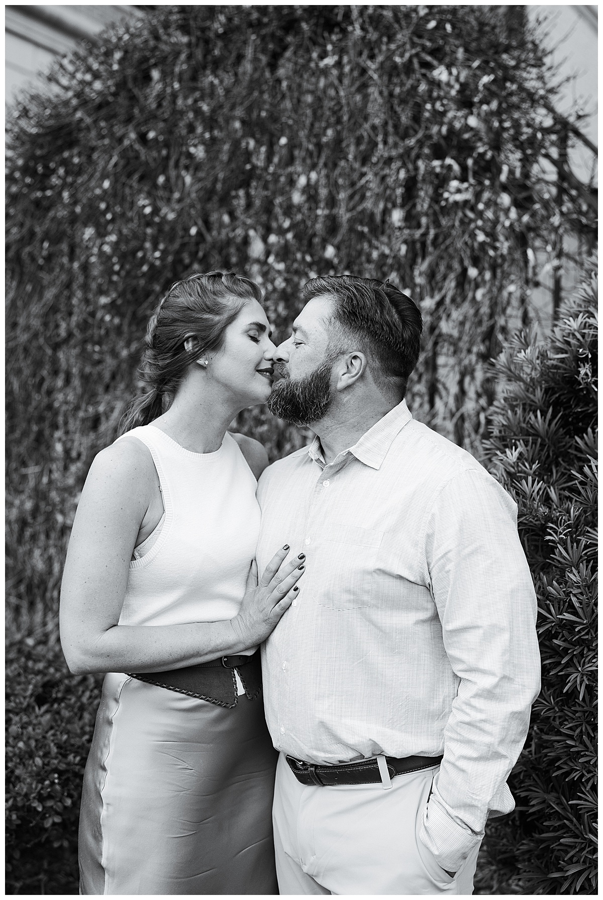 Two people share a kiss for Houston’s Best Wedding Photographers