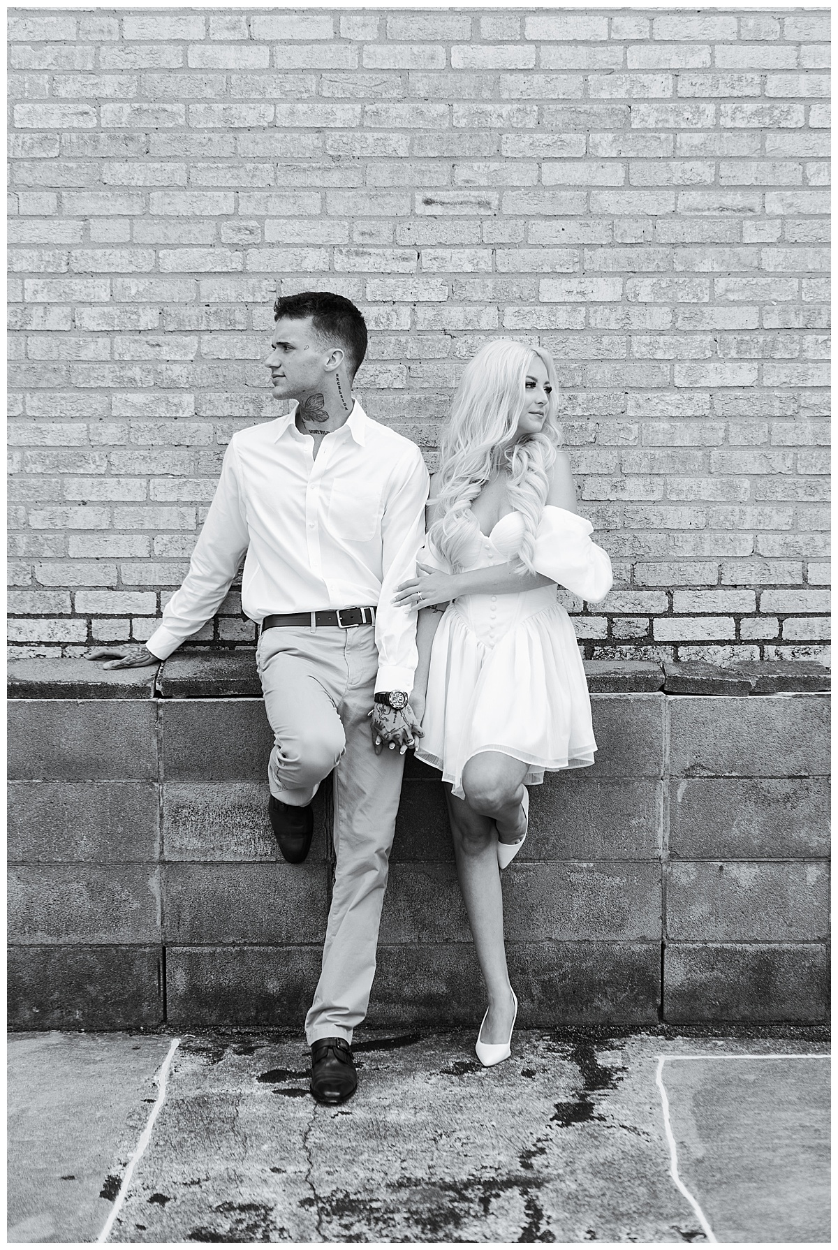 Couple stand together for Downtown Houston Rooftop Engagement Session