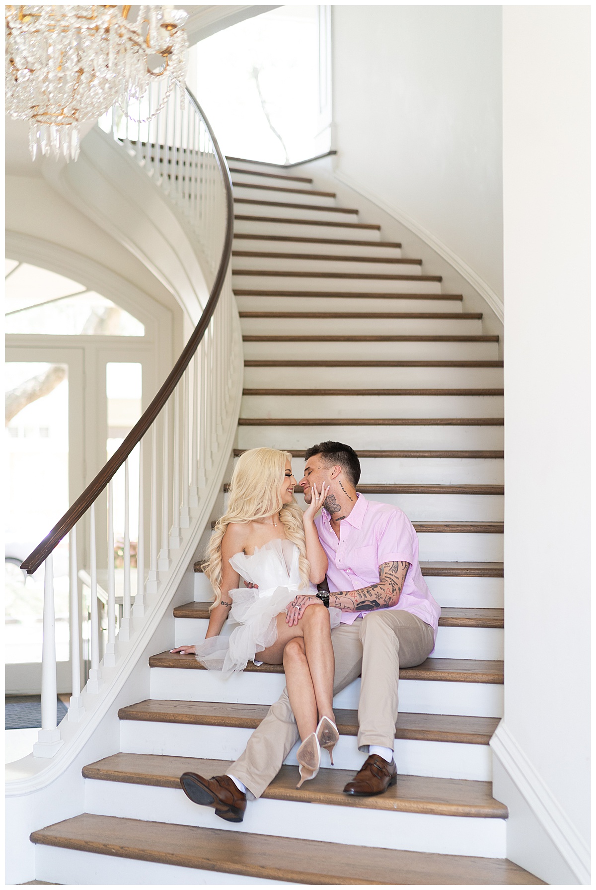 Man and woman share a kiss on the stairs for Swish & Click Photography