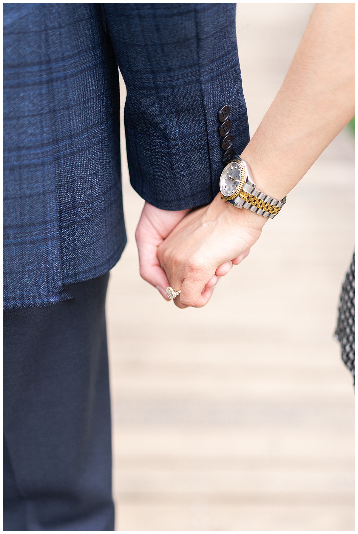 Couple hold hands together for Swish & Click Photography