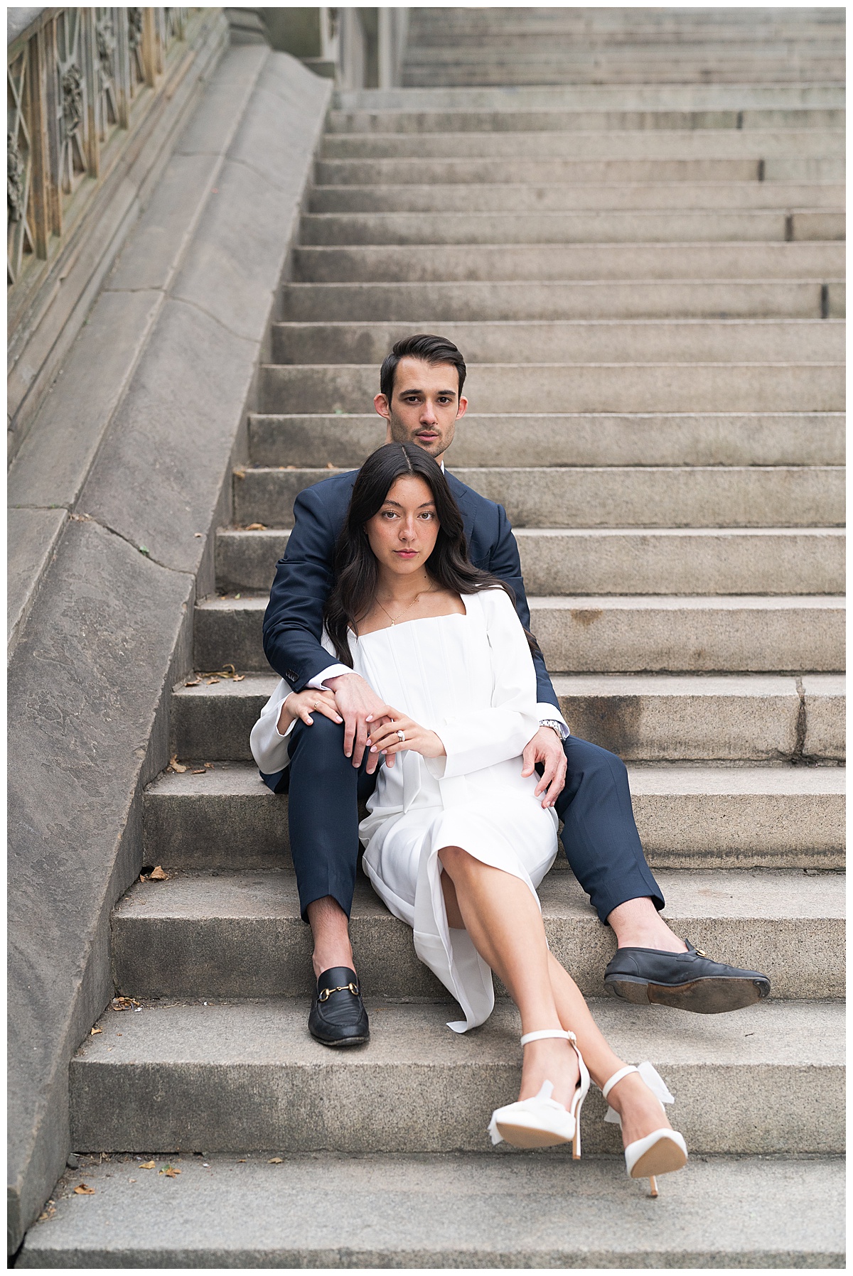 Two people sit on the stairs together for Houston’s Best Wedding Photographers