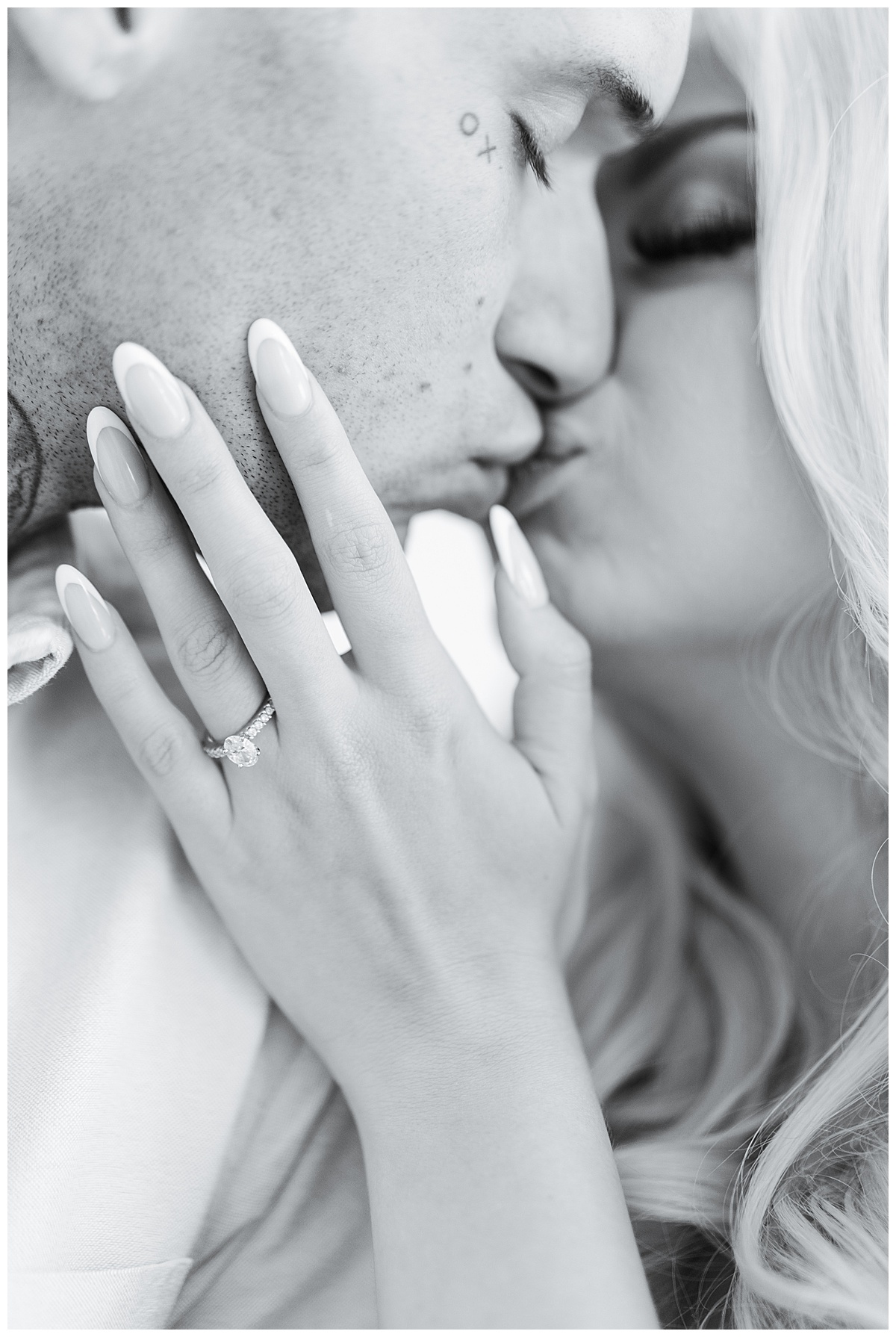 Man and woman share a kiss for Swish & Click Photography