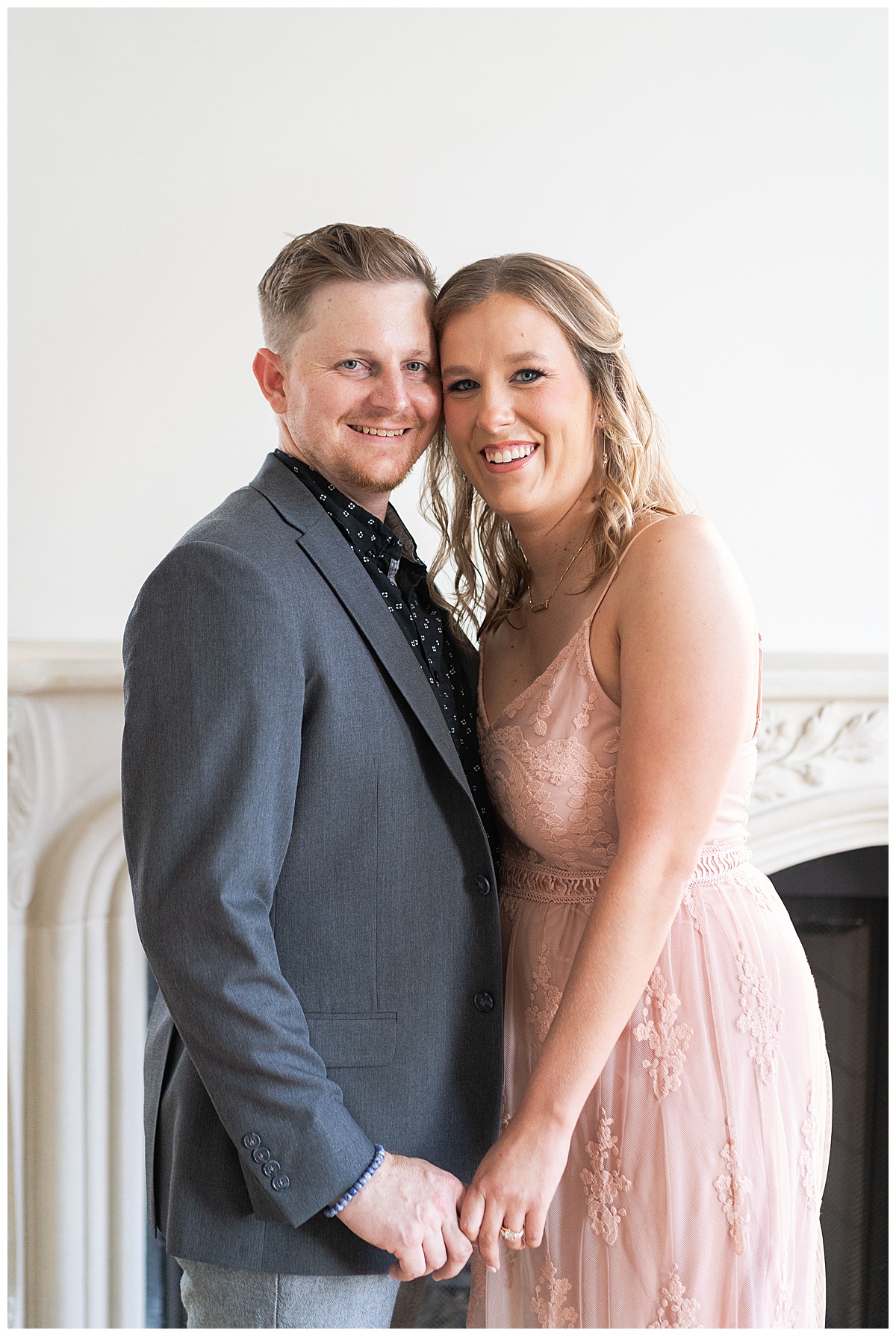 Couple hold each other close and smile together during Houston Engagement session