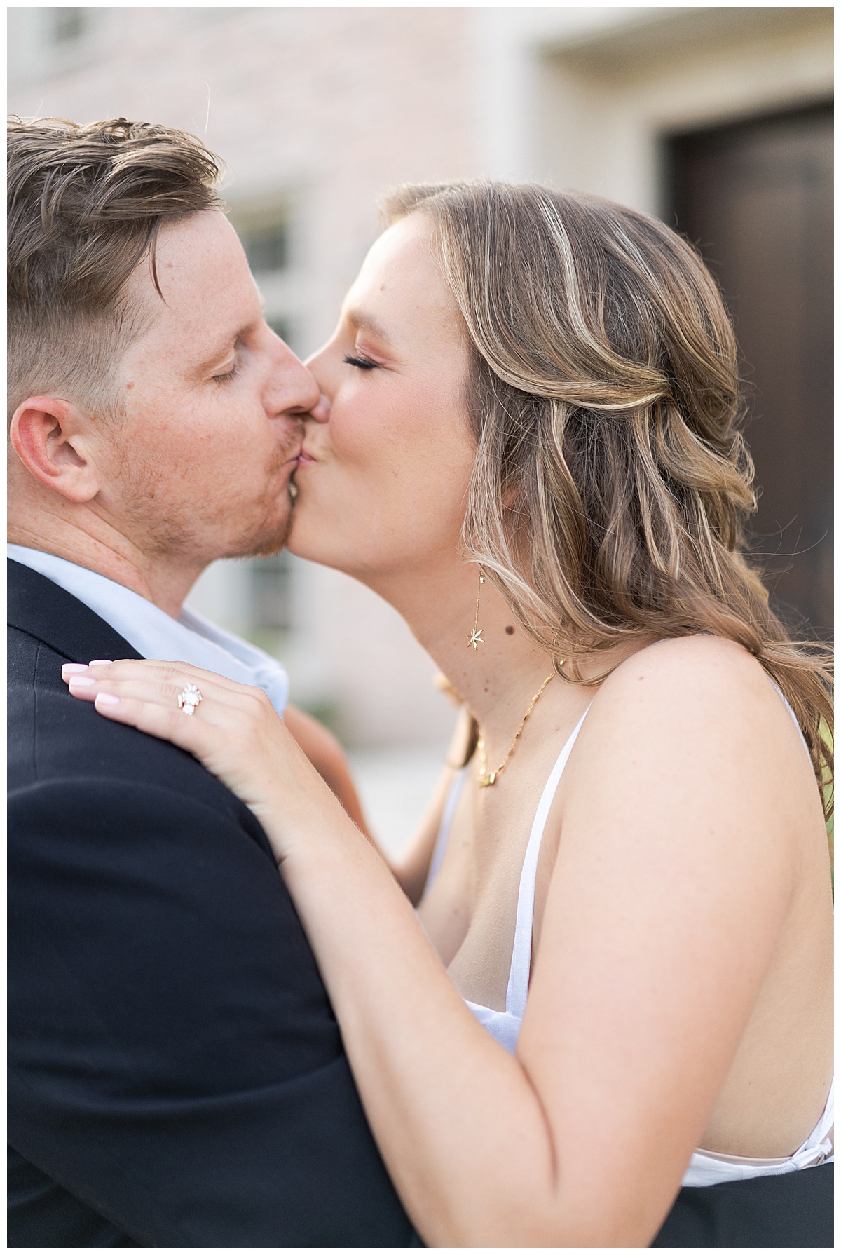 Couple share a kiss for Houston's best engagement photographers