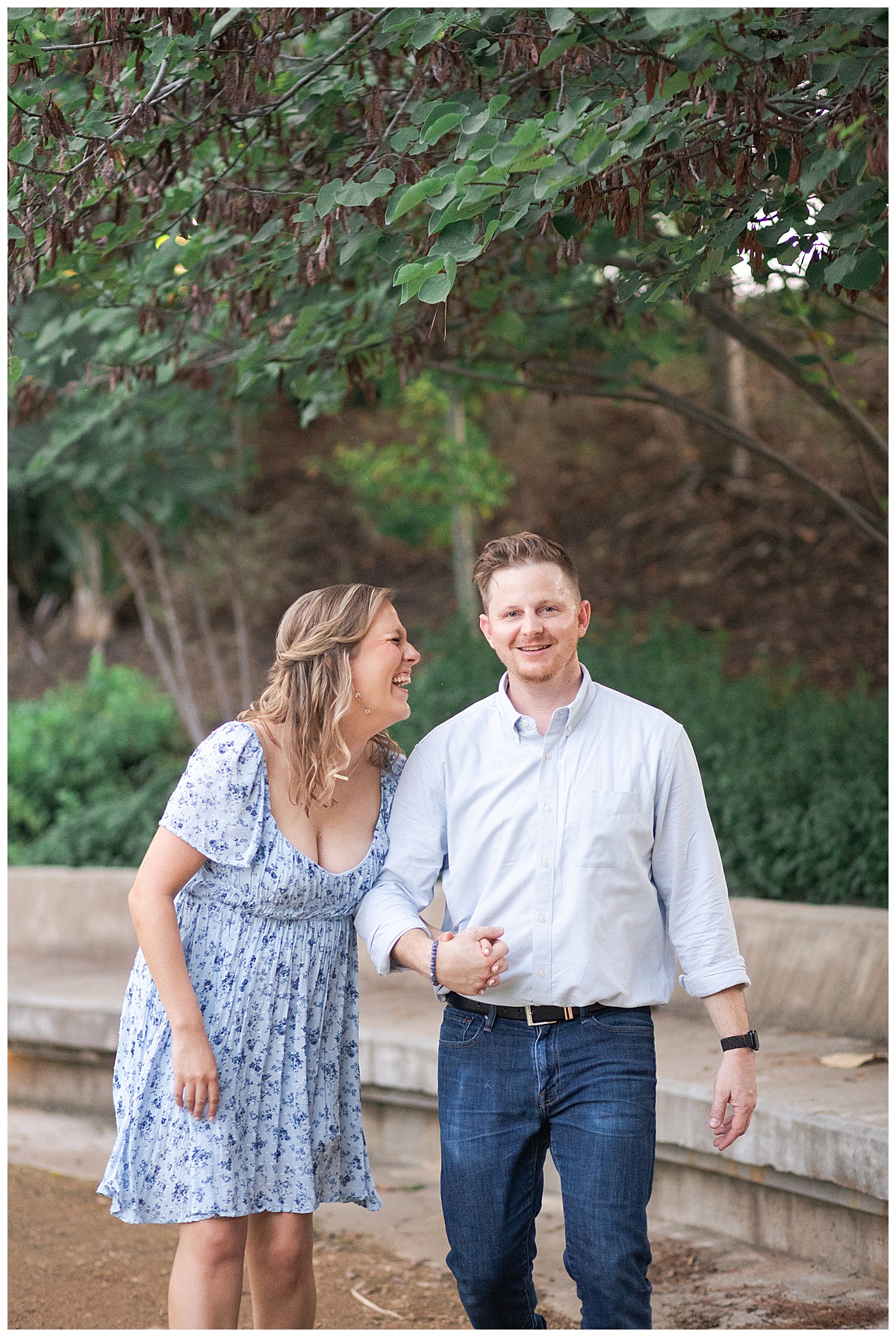 Woman smile and laughs with man for Houston's best engagement photographers