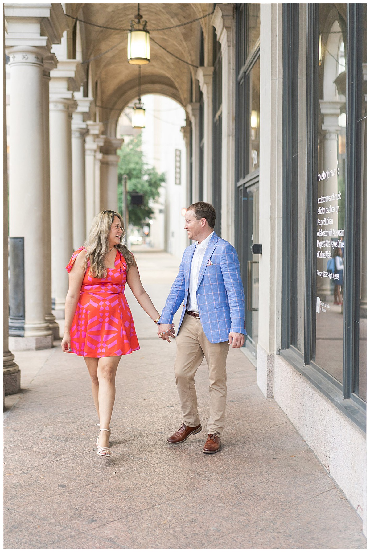 Couple hold hands and walk together during their Modern Houston Engagement Session