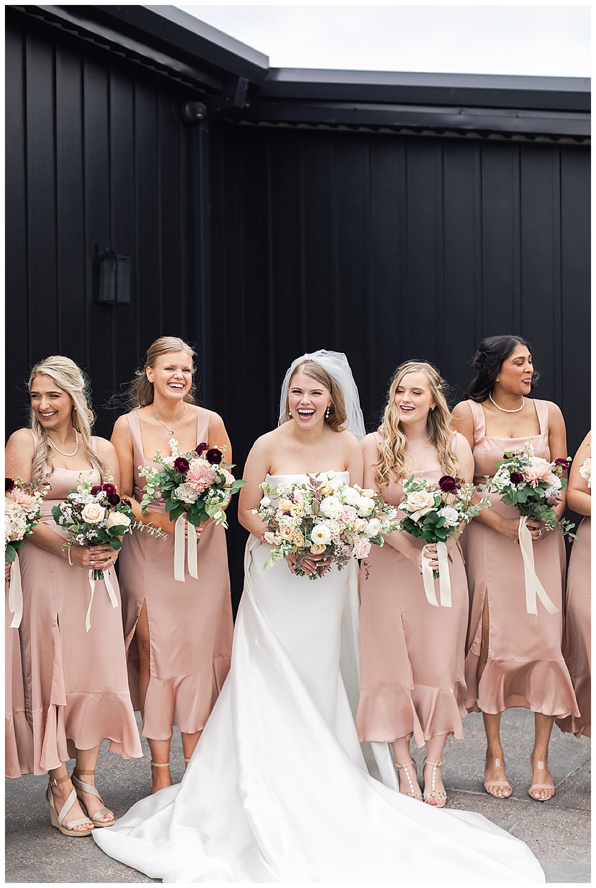 Bride stand with bridesmaids at Houston Wedding Venue