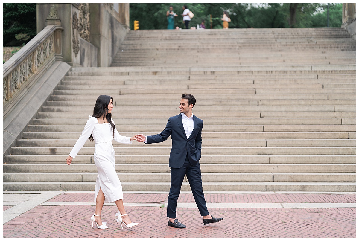 Couple walk together hand in hand demonstrating one of the Best Engagement Session Poses 