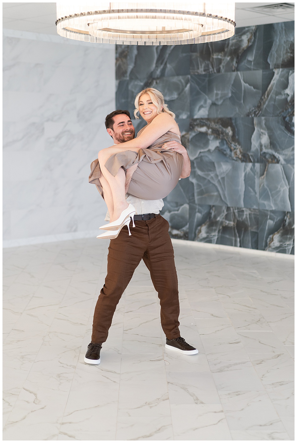 Man carries woman for Houston Engagement Photographer