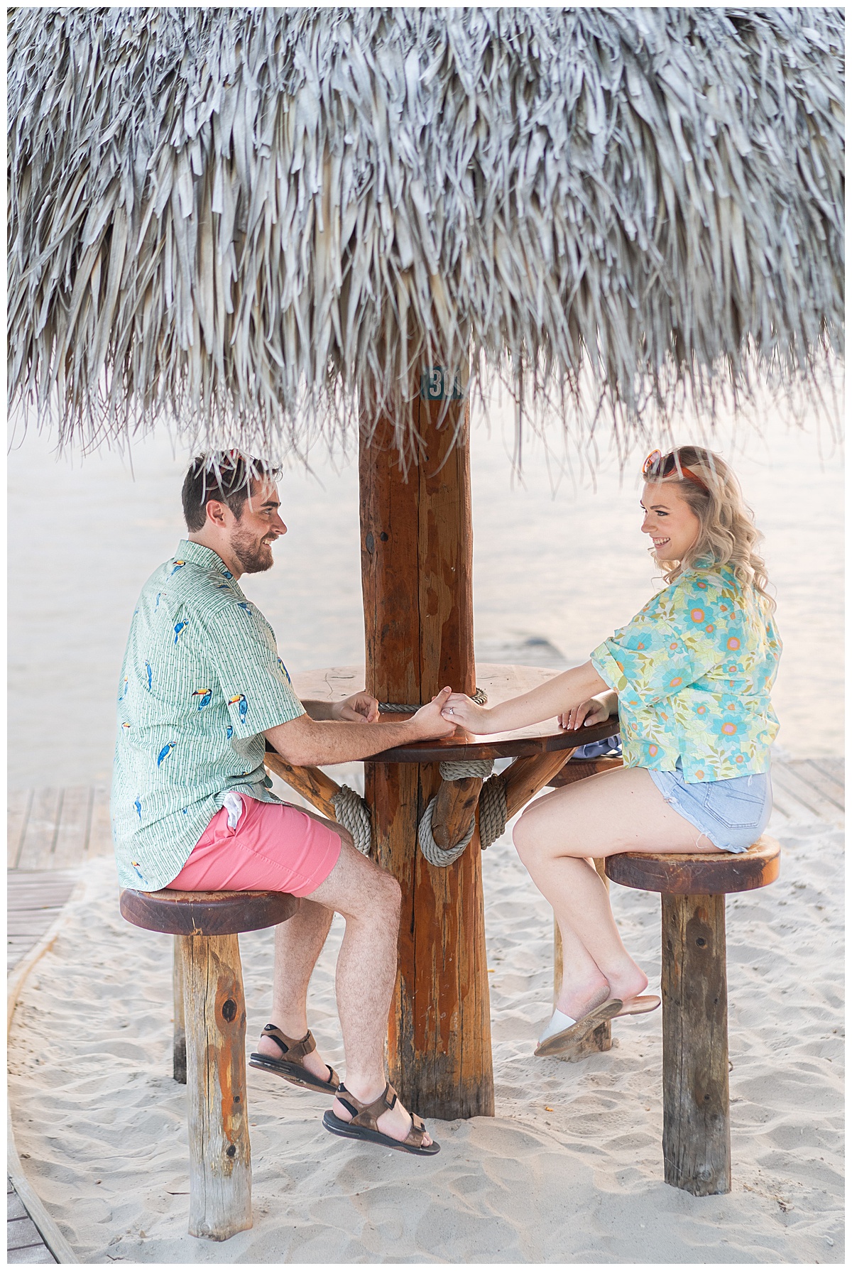 Two people sit on cabana hut for Houston’s Best Wedding Photographers