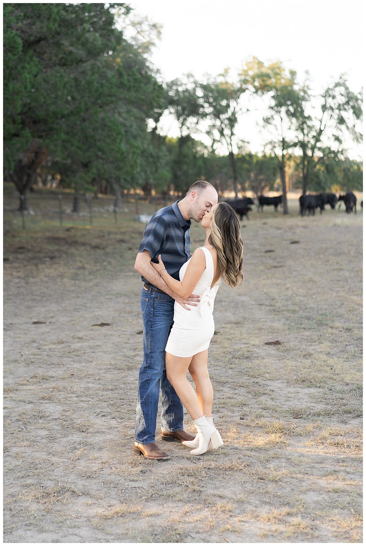 Man and woman share a kiss for Austin Engagement Session