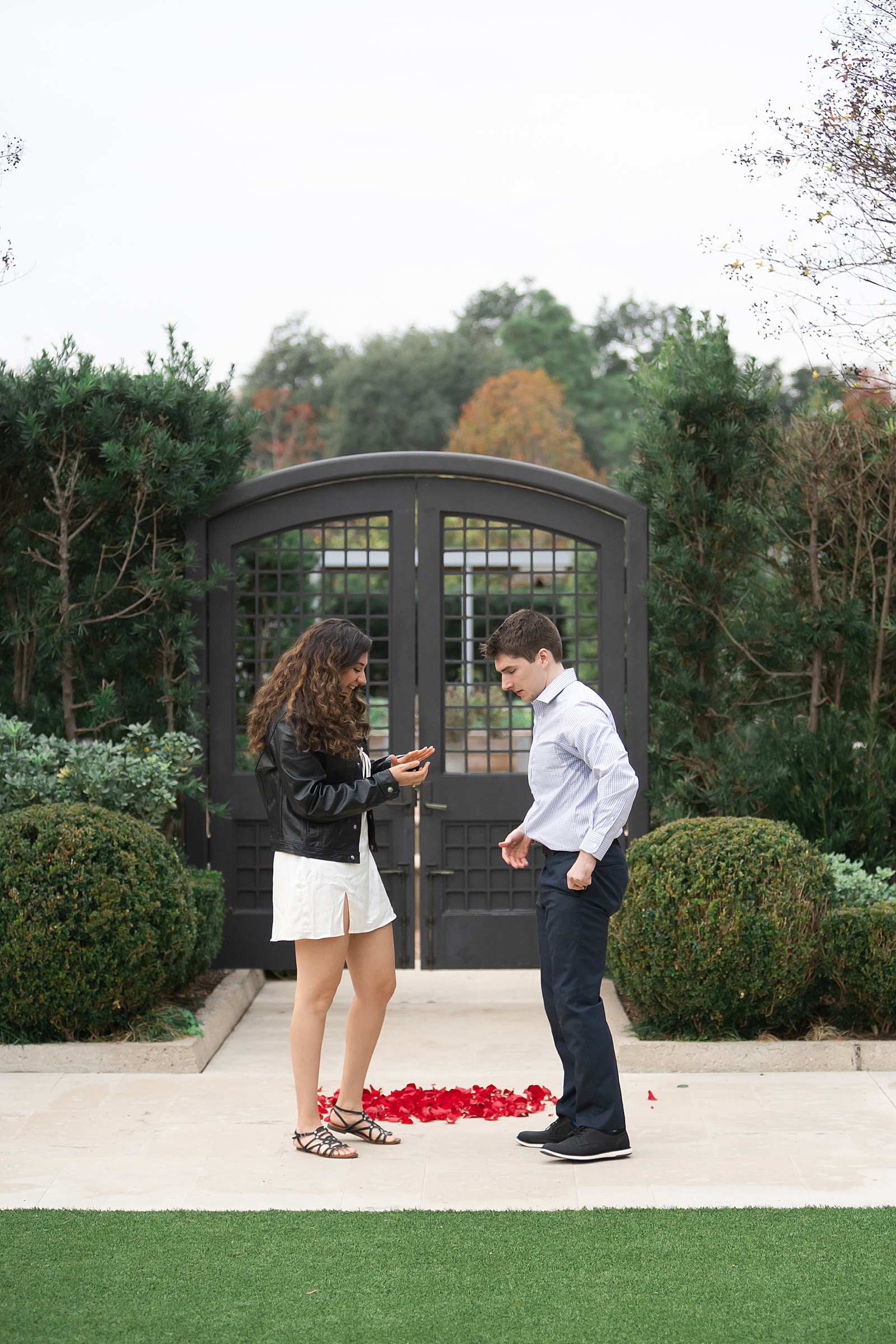 Woman smiles at ring by Houston Marriage Proposal Photographer