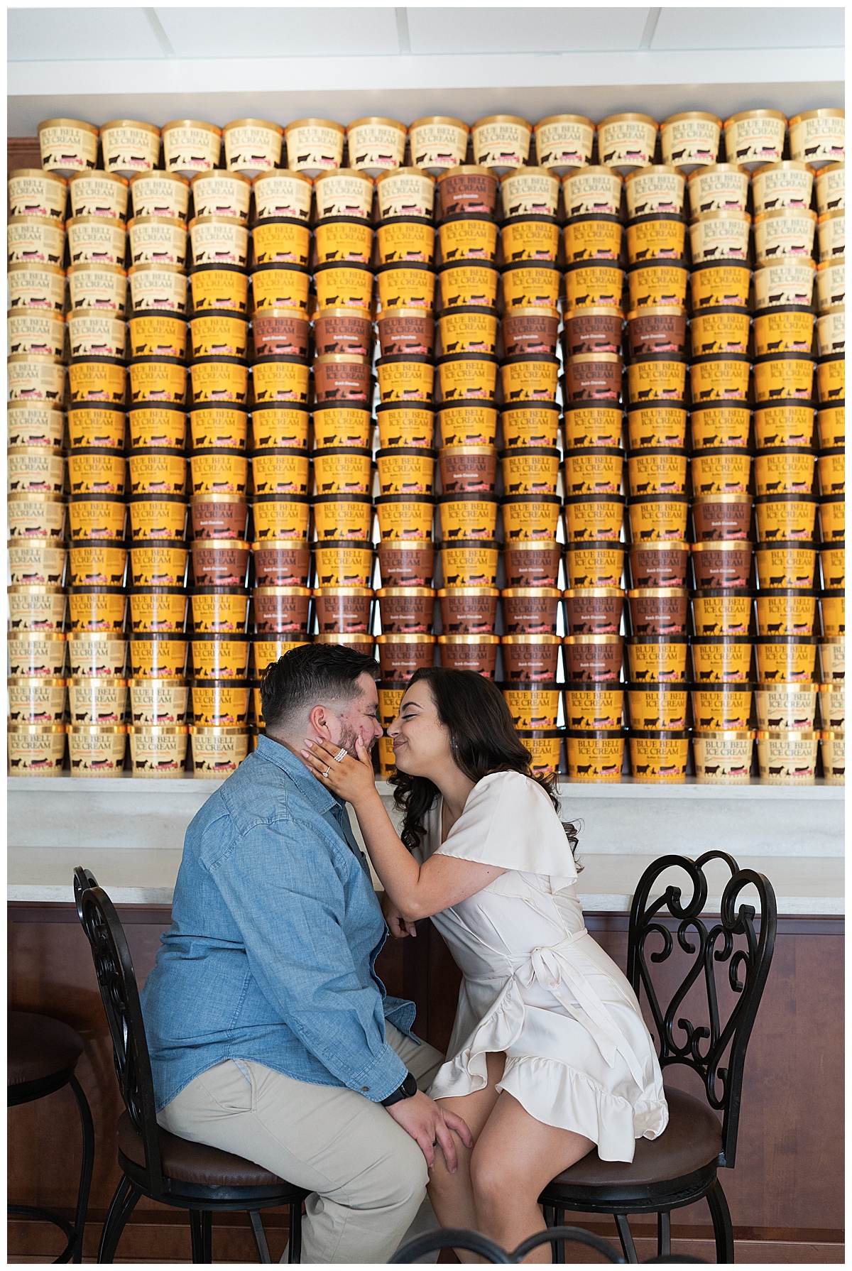 Man and woman sit together during Blue Bell Engagement Session