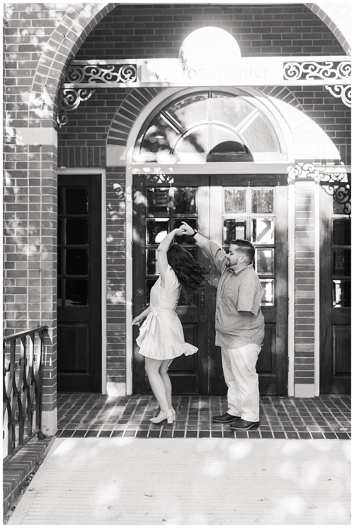 Man and woman dance together during Blue Bell Engagement Session