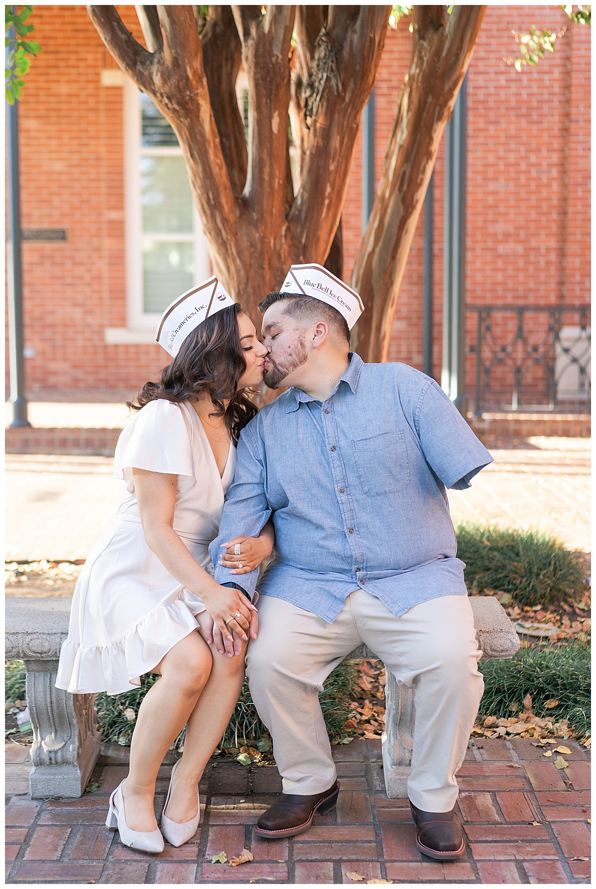Man and woman share a kiss during Blue Bell Engagement Session