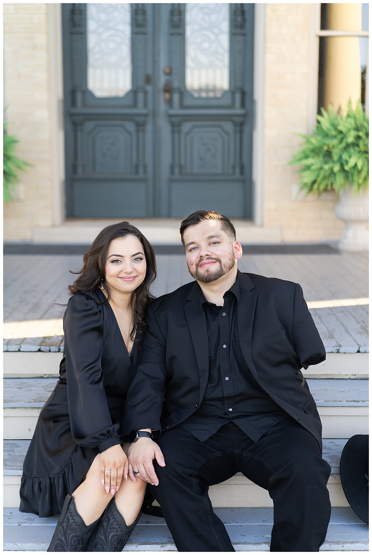Man and woman sit together on steps for Houston’s Best Wedding Photographers