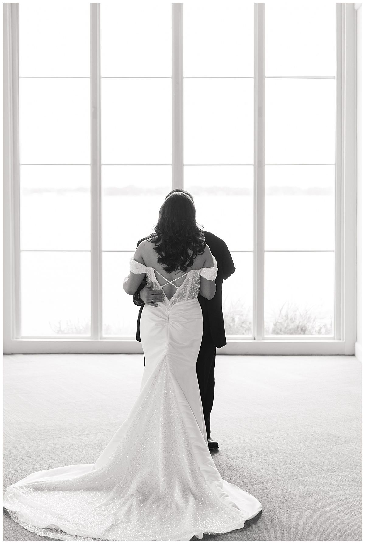 Groom hugs bride during wedding at Bentwater Yacht and Country Club