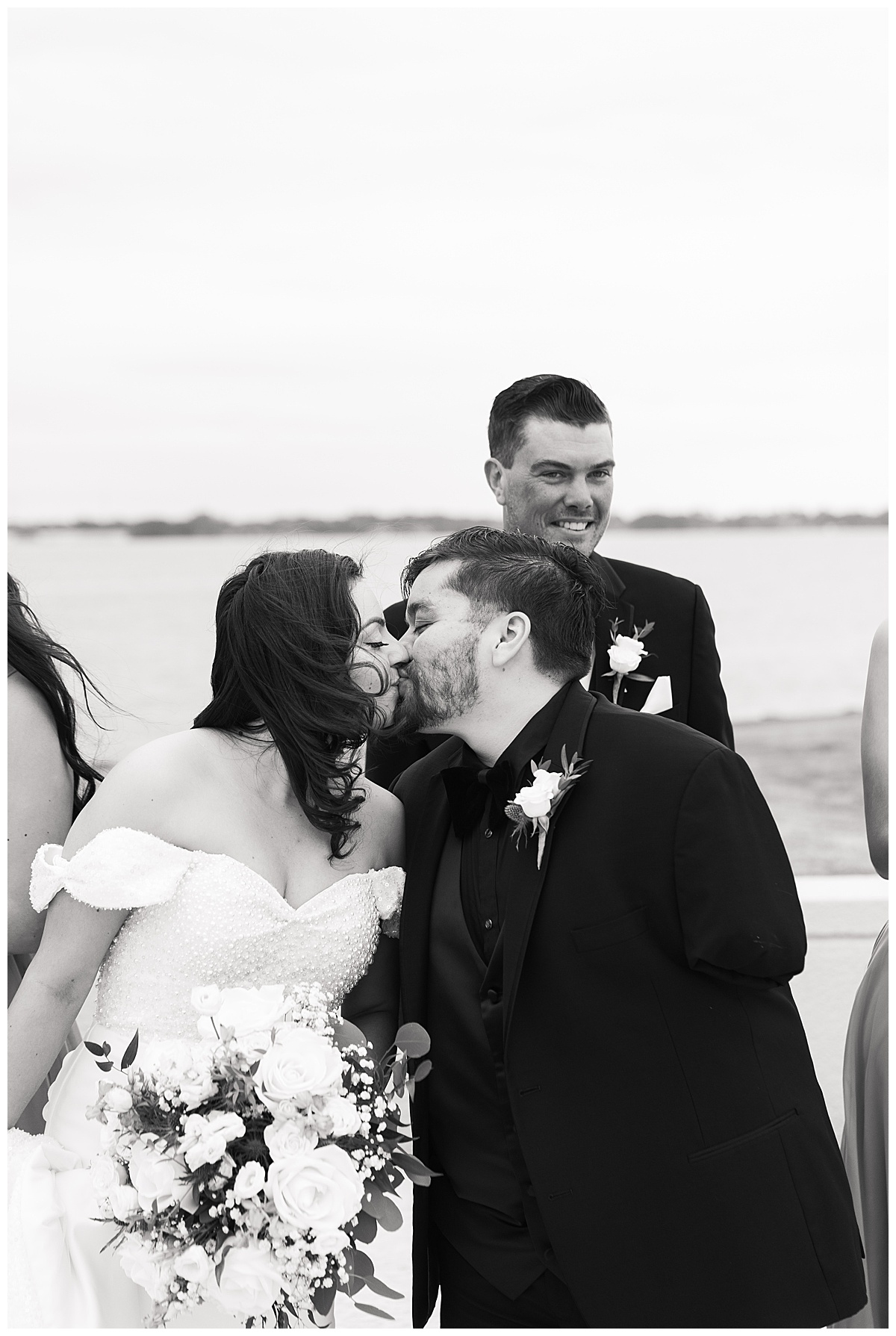 Bride and groom share a kiss for Swish & Click Photography