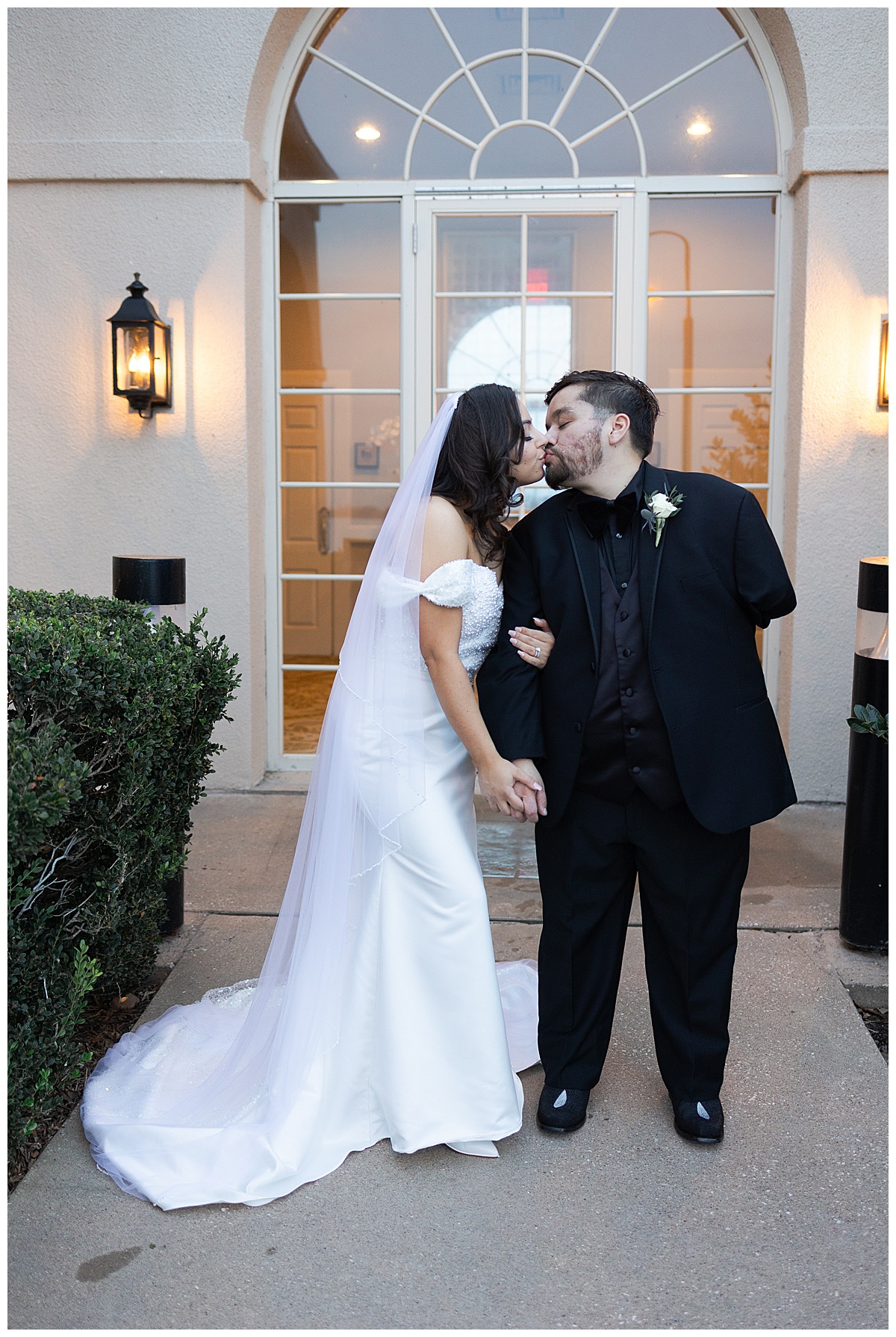 Bride and groom share kiss for Swish & Click Photography