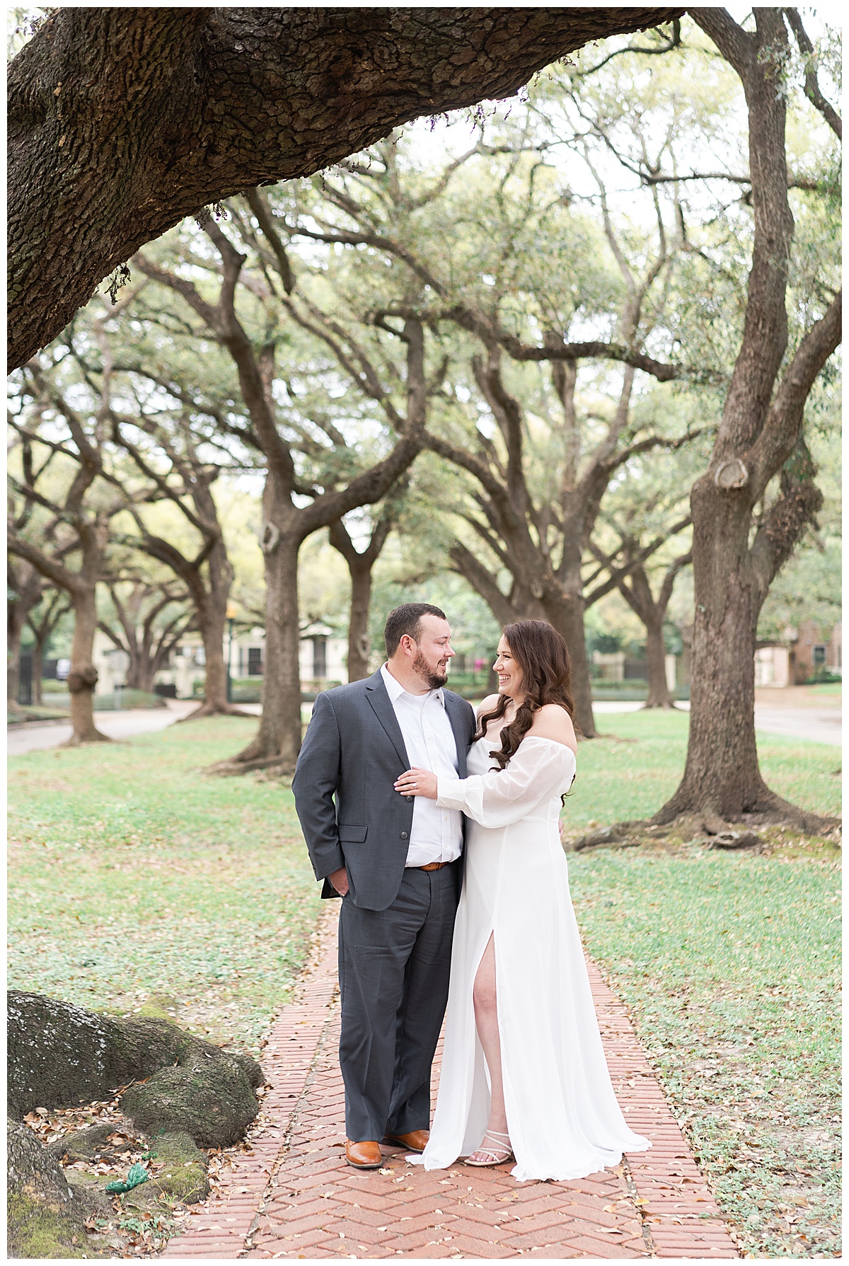 Couple smile at one another during their Boulevard Oaks Engagement Session