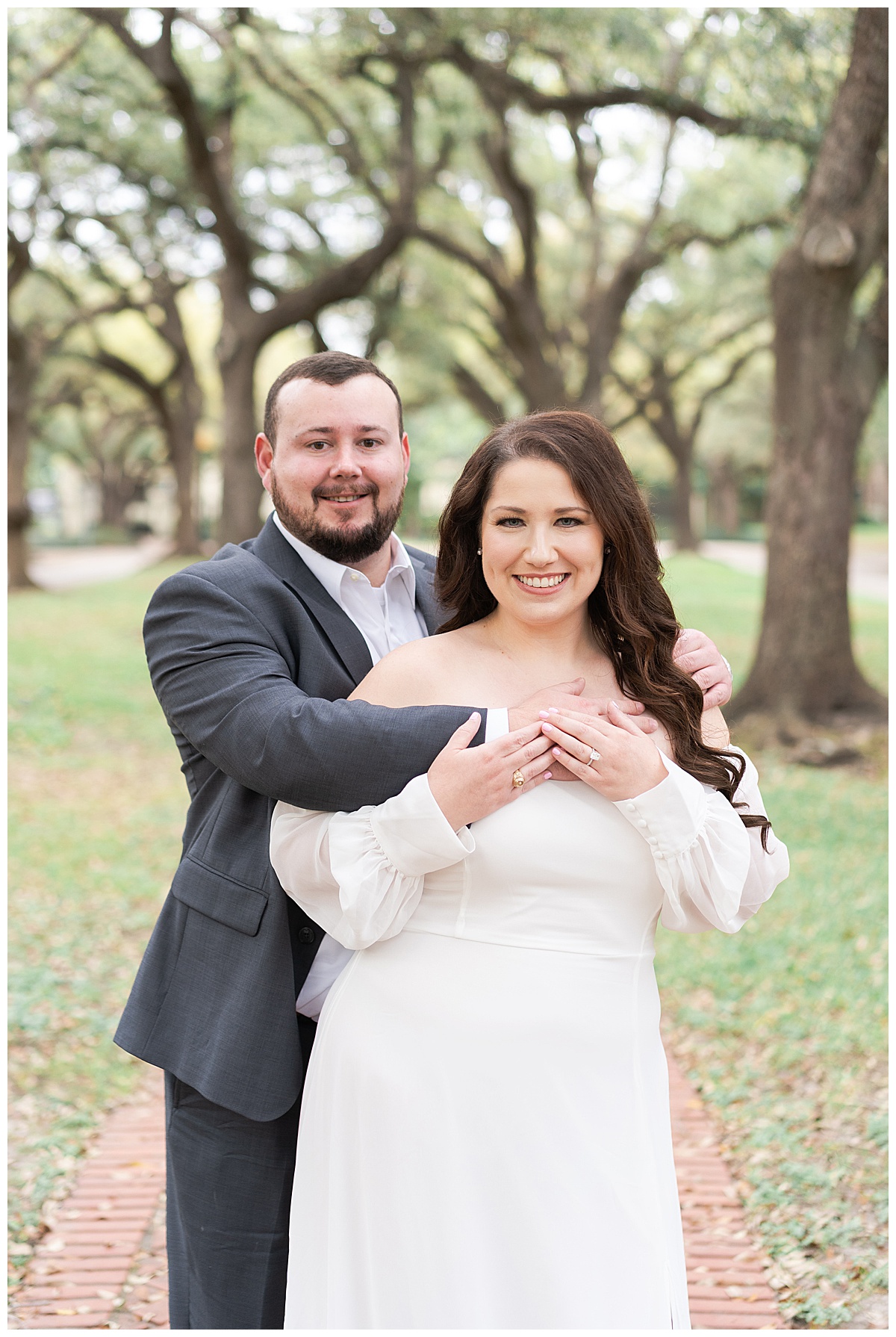 Couple smile together during their Boulevard Oaks Engagement Session