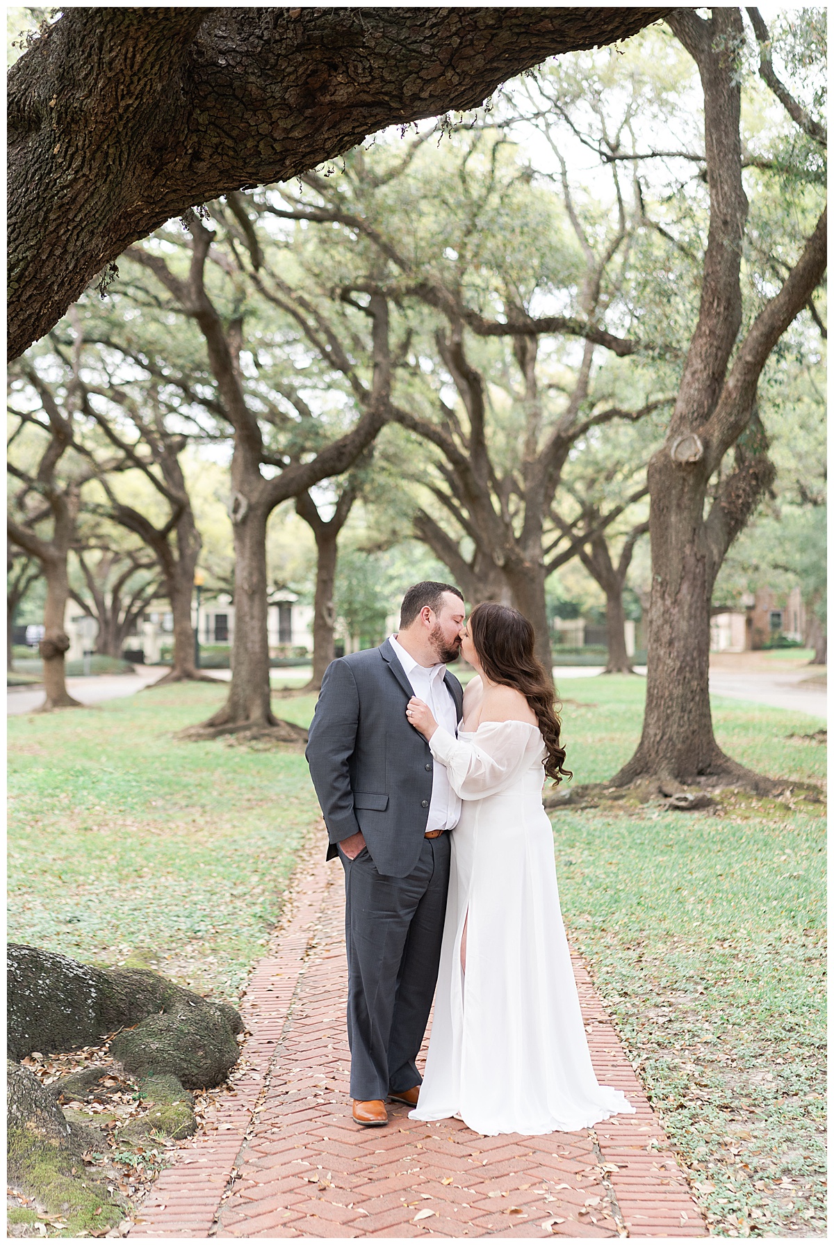 Couple share a kiss during their Boulevard Oaks Engagement Session