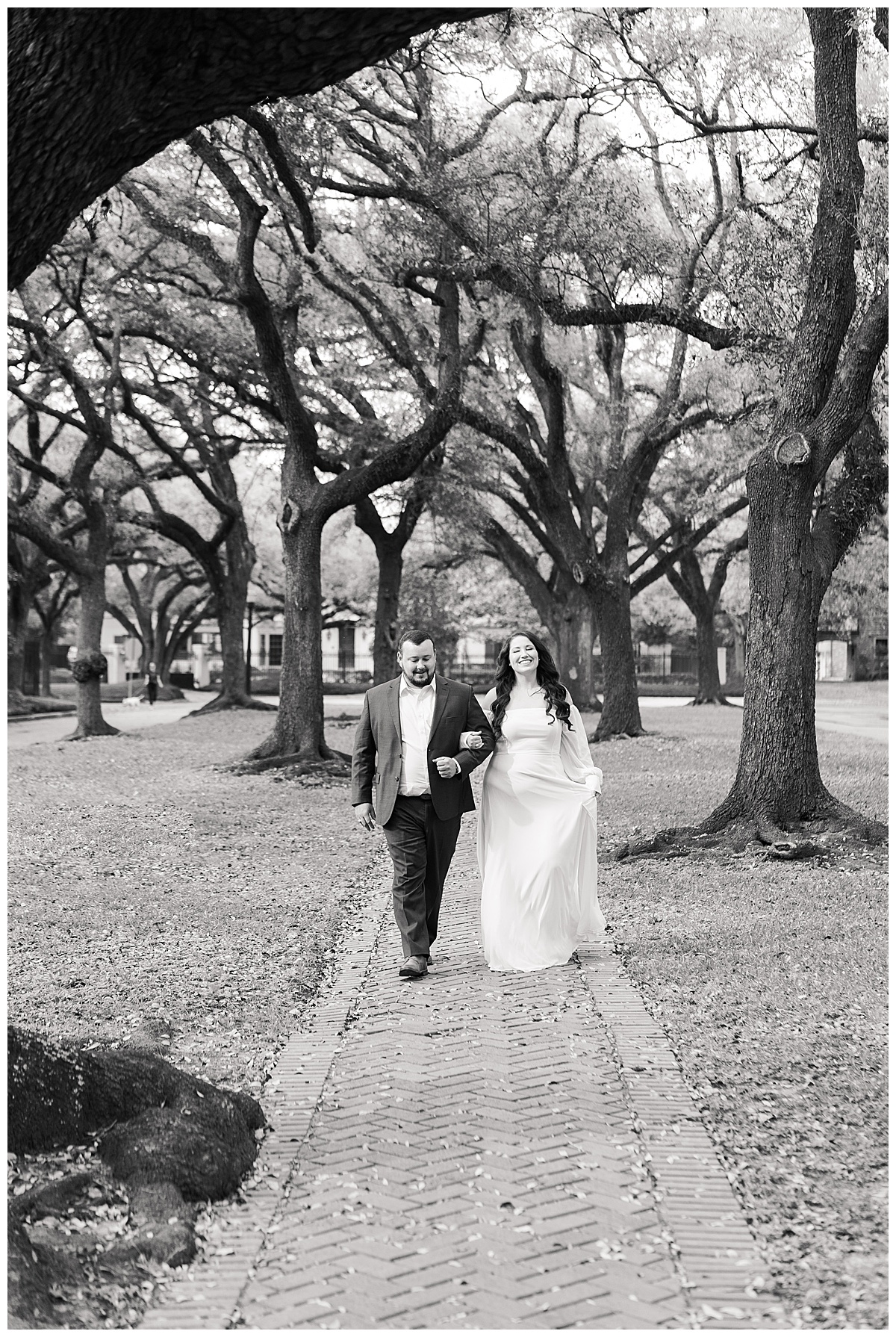 Couple walk together during their Boulevard Oaks Engagement Session