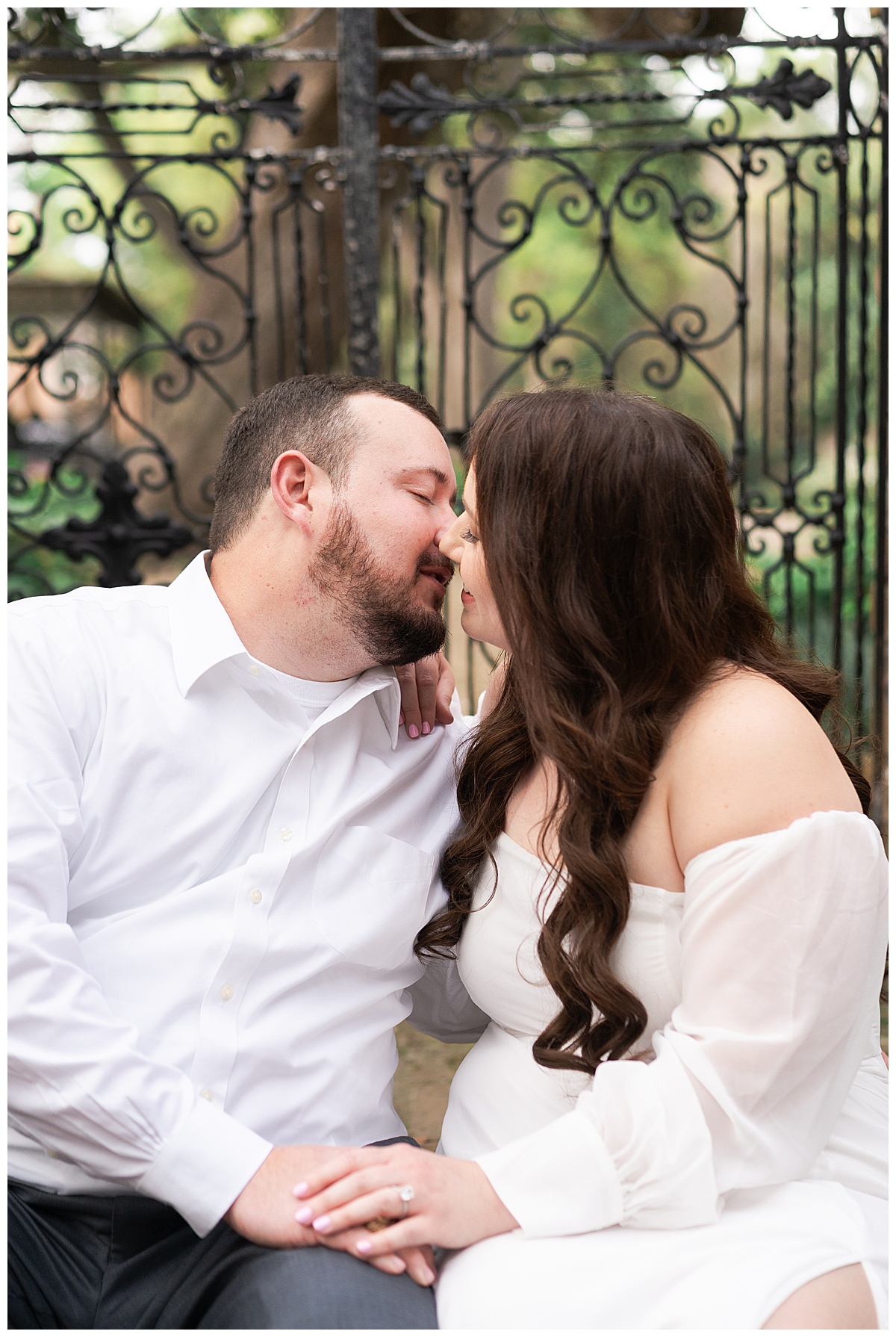 Couple share a kiss together for Swish & Click Photography