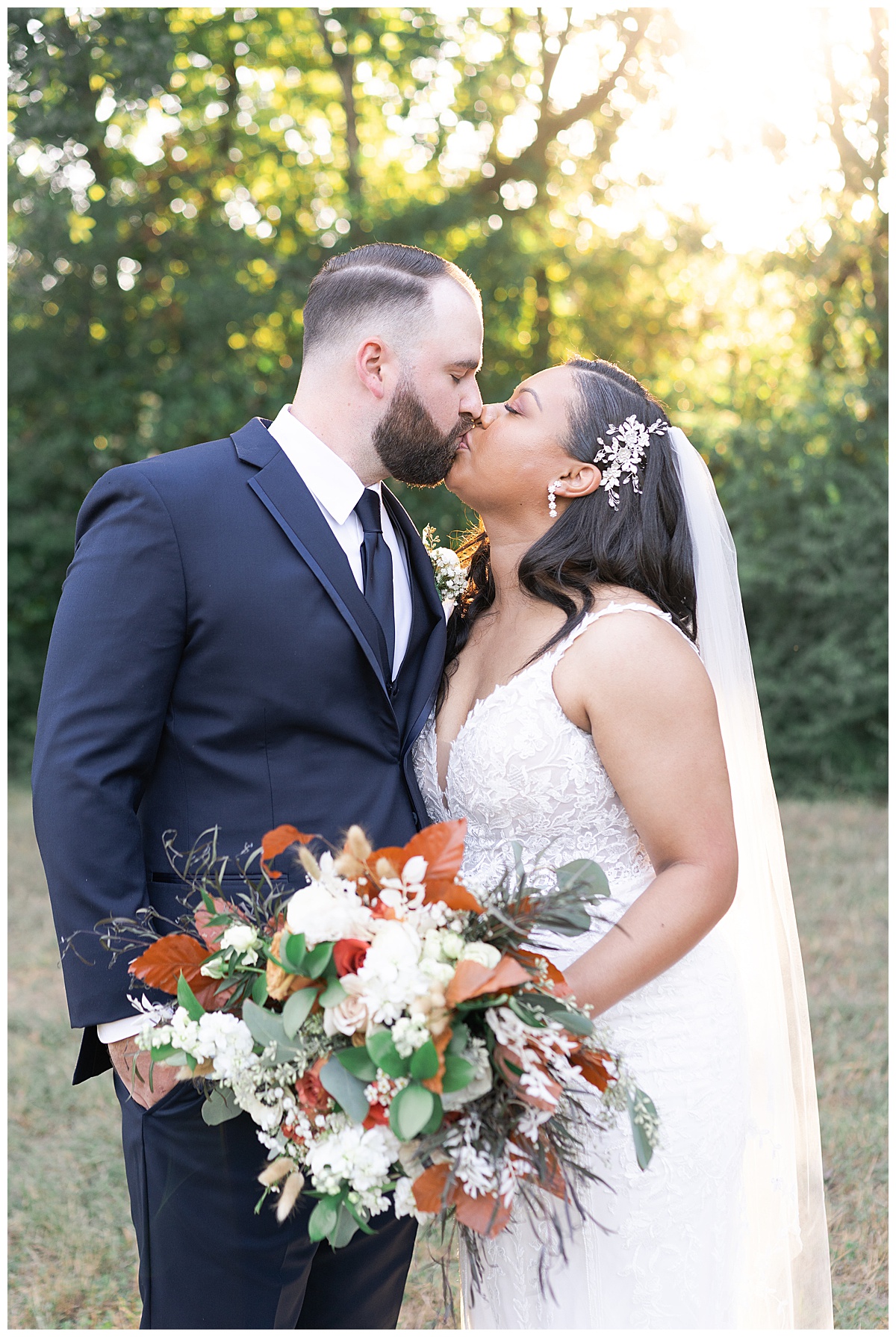 Couple share a kiss showing off 70's Inspired Wedding Ideas